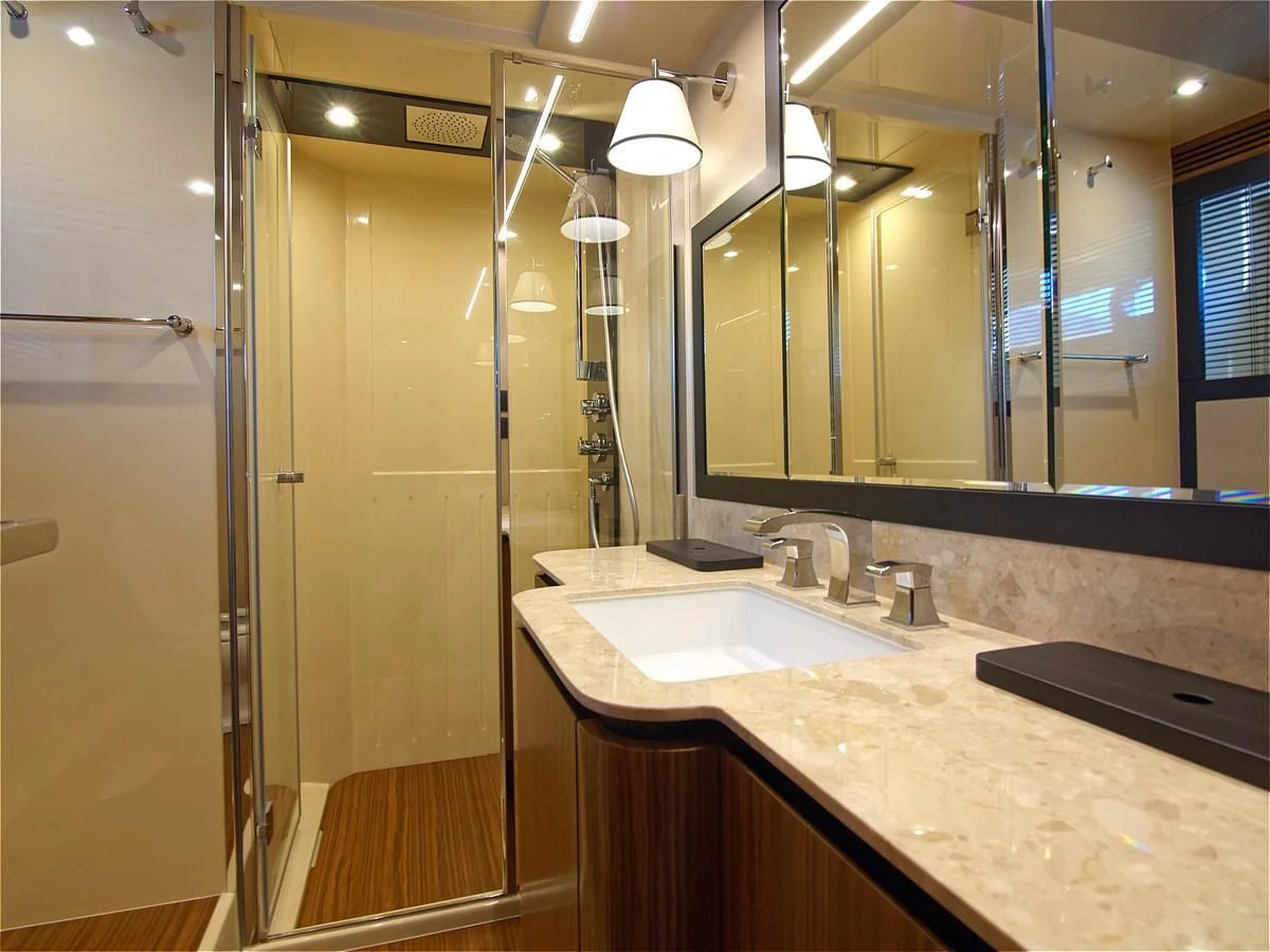 a bathroom with a large mirror aboard 2017 AZIMUT 66 MAGELLANO Yacht for Sale
