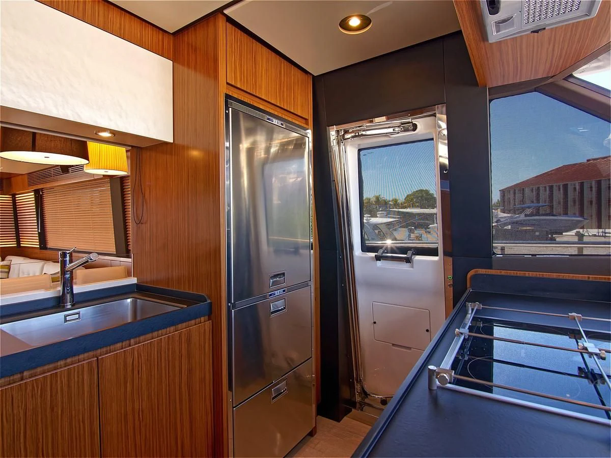 a kitchen with a glass door aboard 2017 AZIMUT 66 MAGELLANO Yacht for Sale