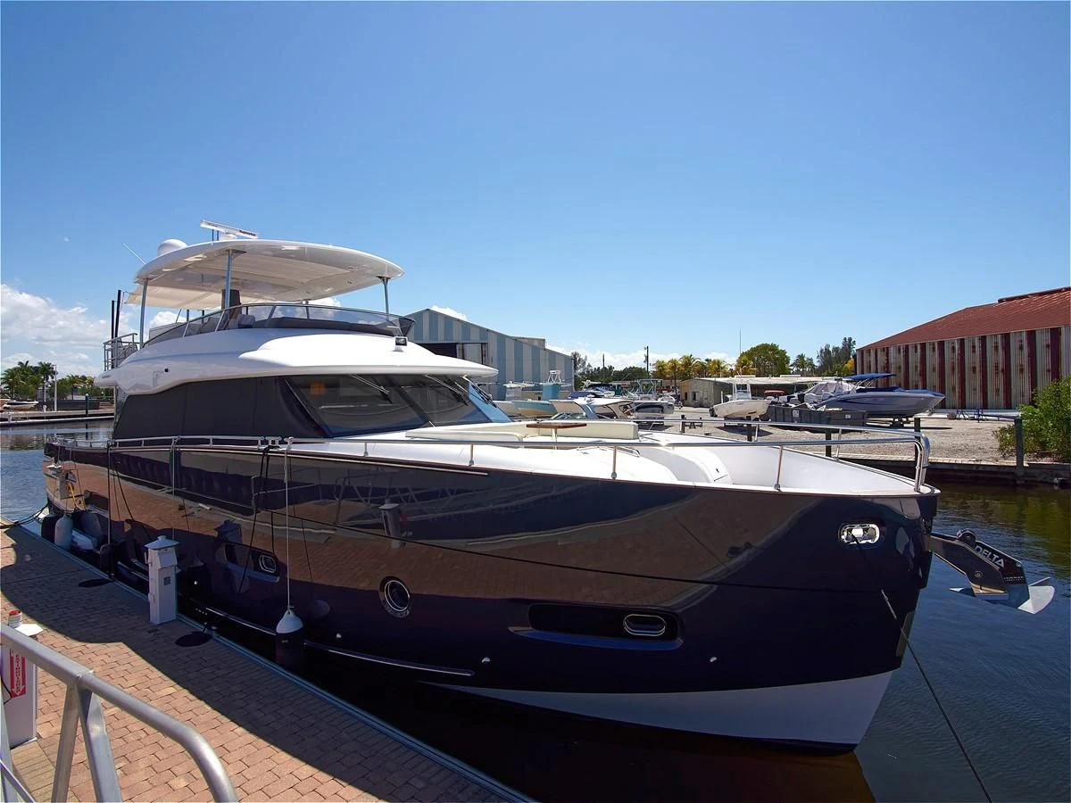 a boat docked at a pier aboard 2017 AZIMUT 66 MAGELLANO Yacht for Sale