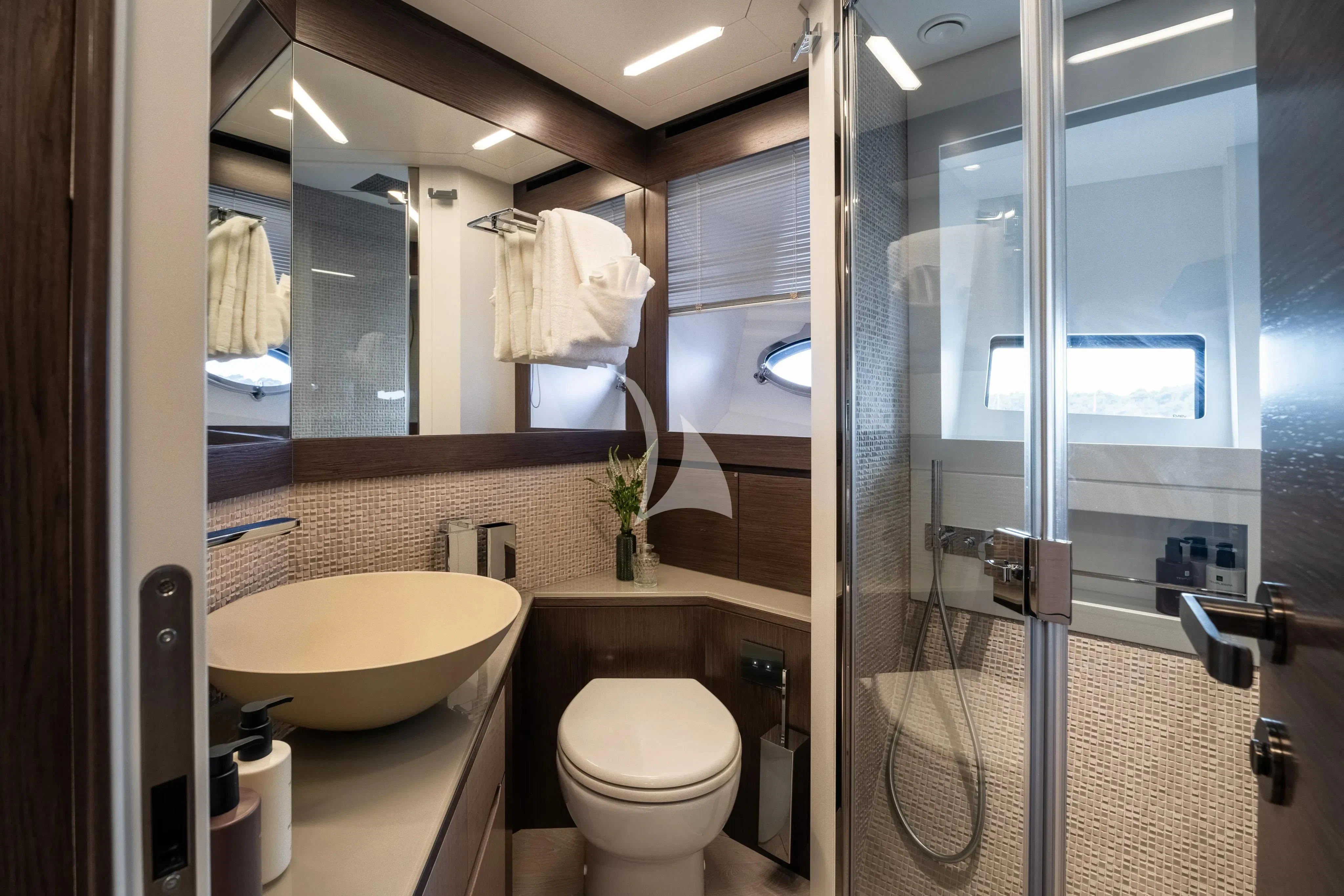 a bathroom with a glass shower aboard CHERRY Yacht for Charter