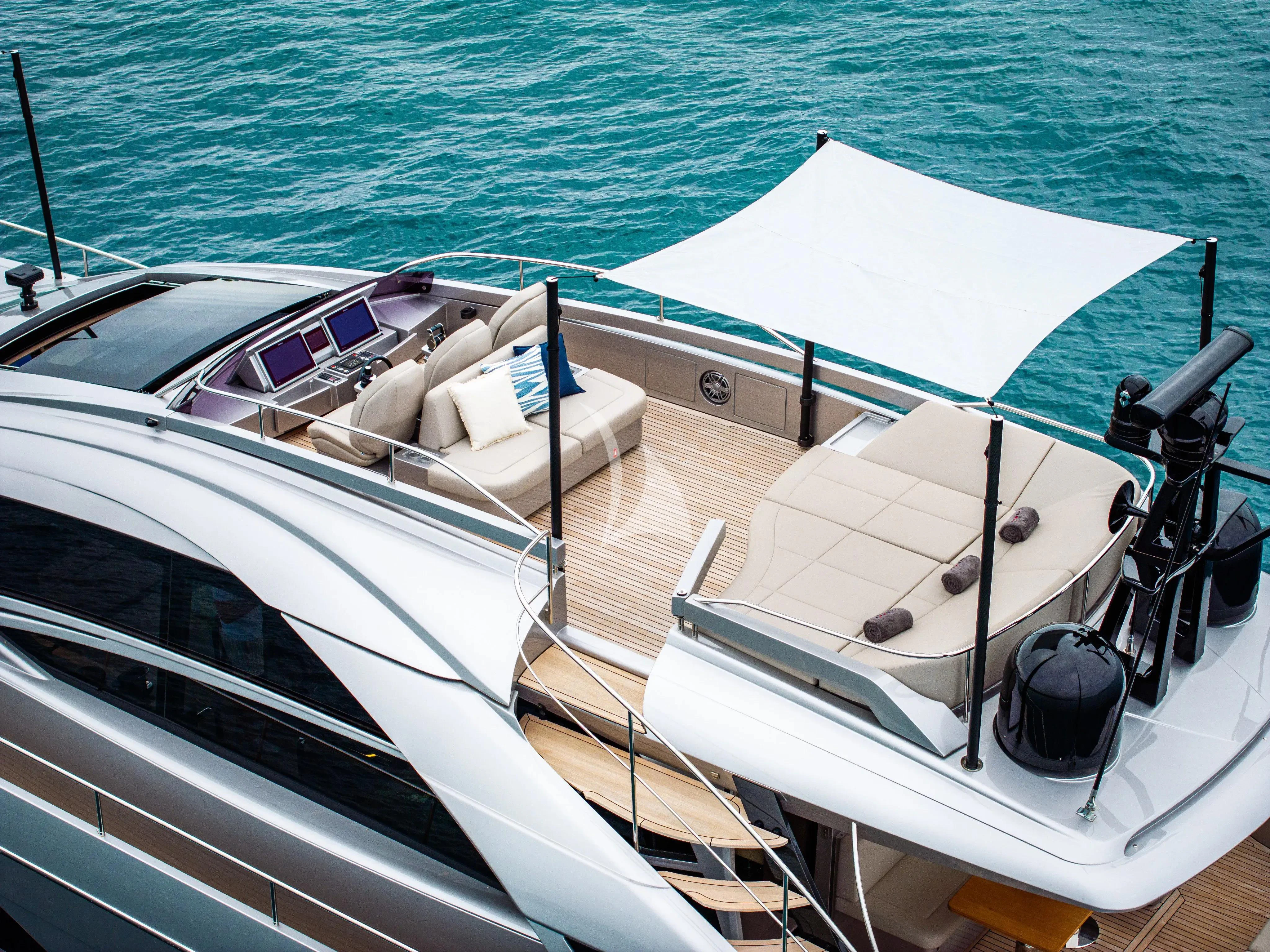 a boat with a white umbrella aboard CHERRY Yacht for Charter