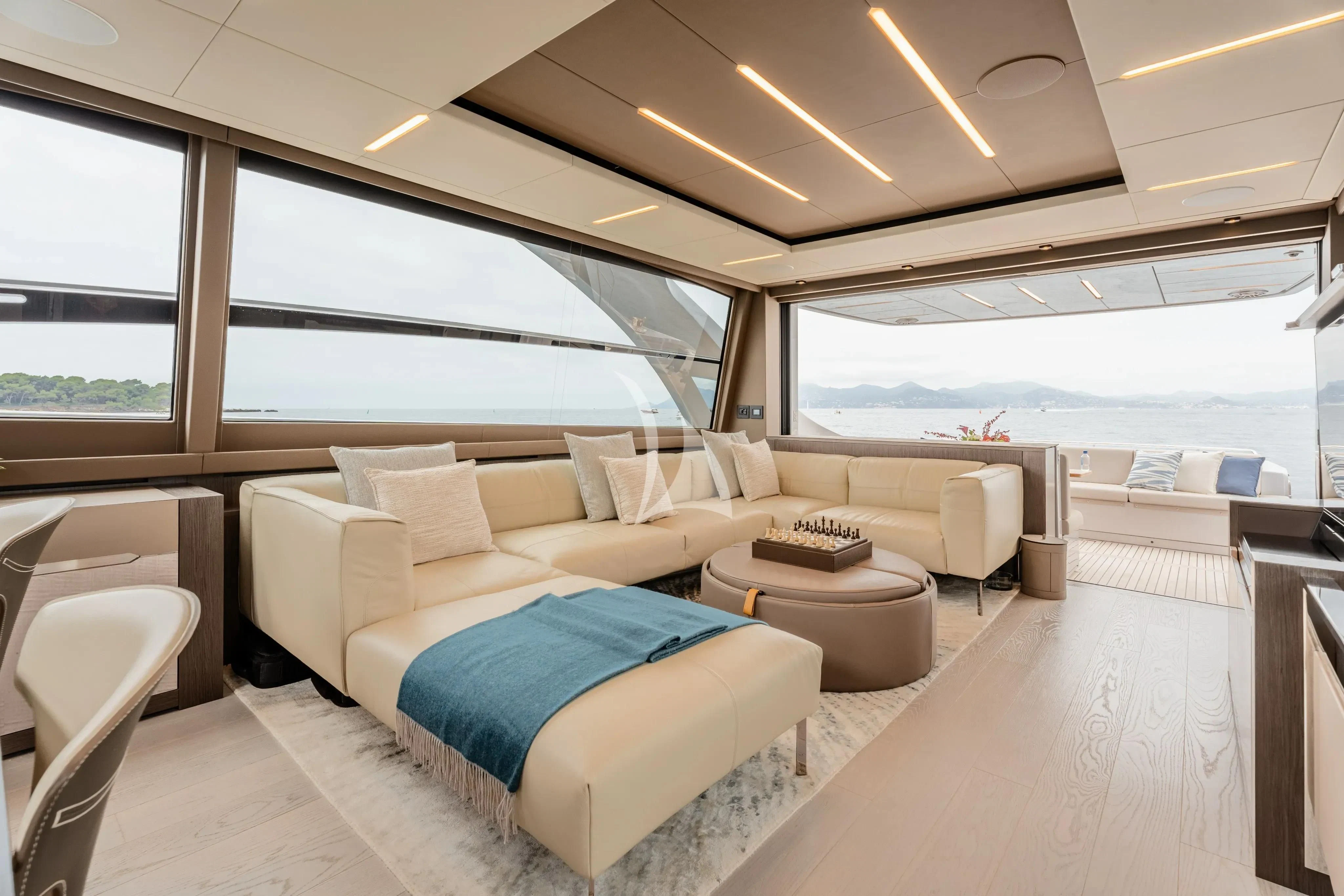 a living room with a large window aboard CHERRY Yacht for Charter
