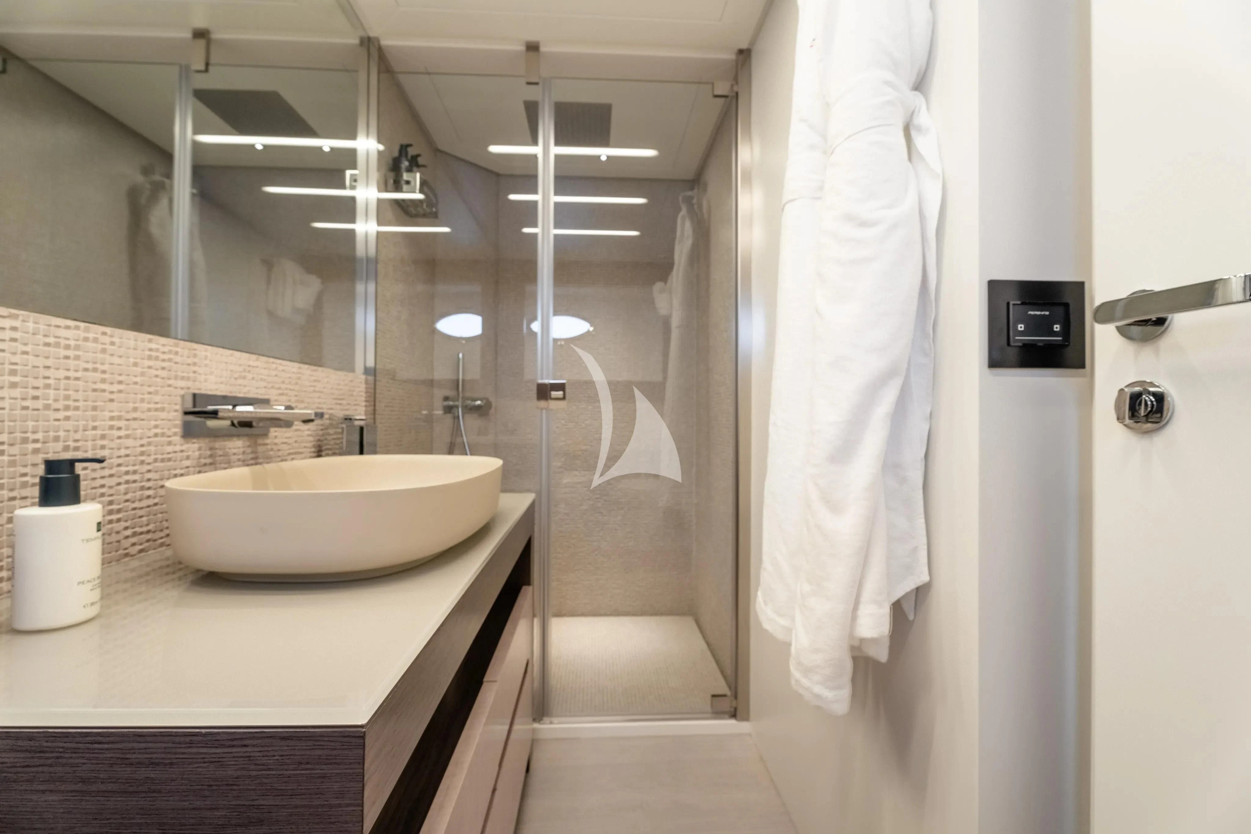 a bathroom with a sink and a shower aboard CHERRY Yacht for Charter