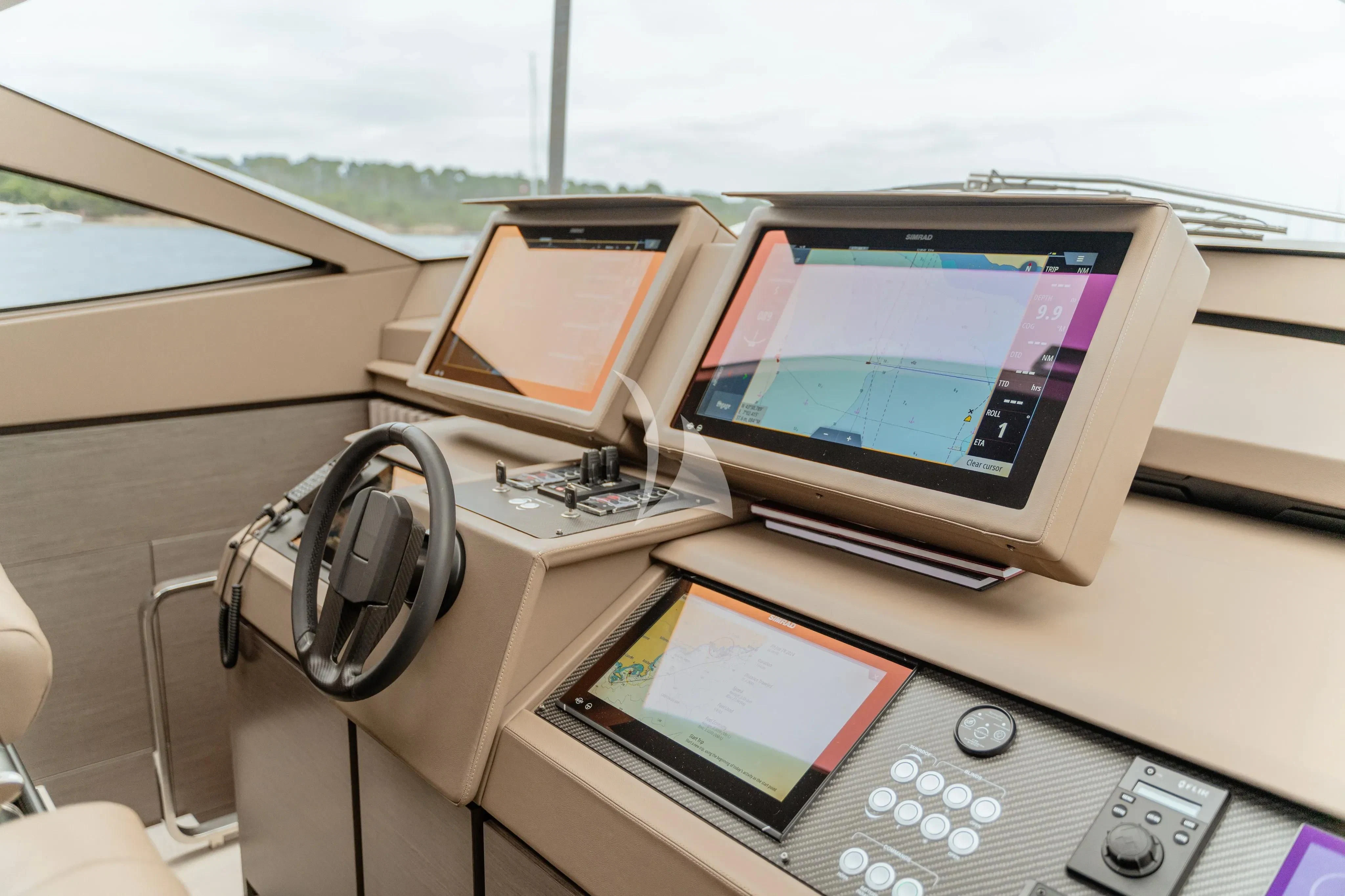 a desk with a computer and other electronic devices on it aboard CHERRY Yacht for Charter