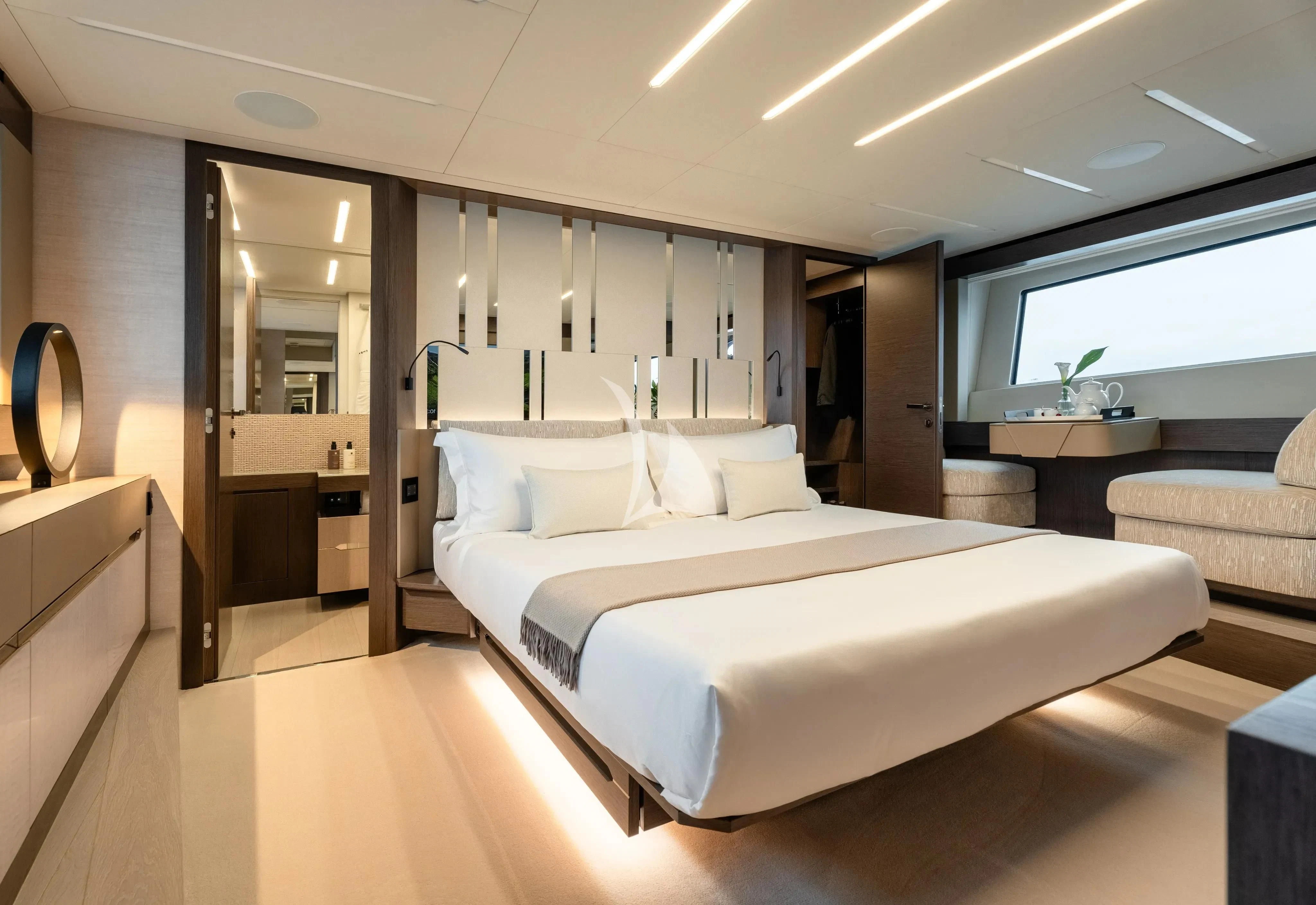 a room with a bed and a mirror aboard CHERRY Yacht for Charter