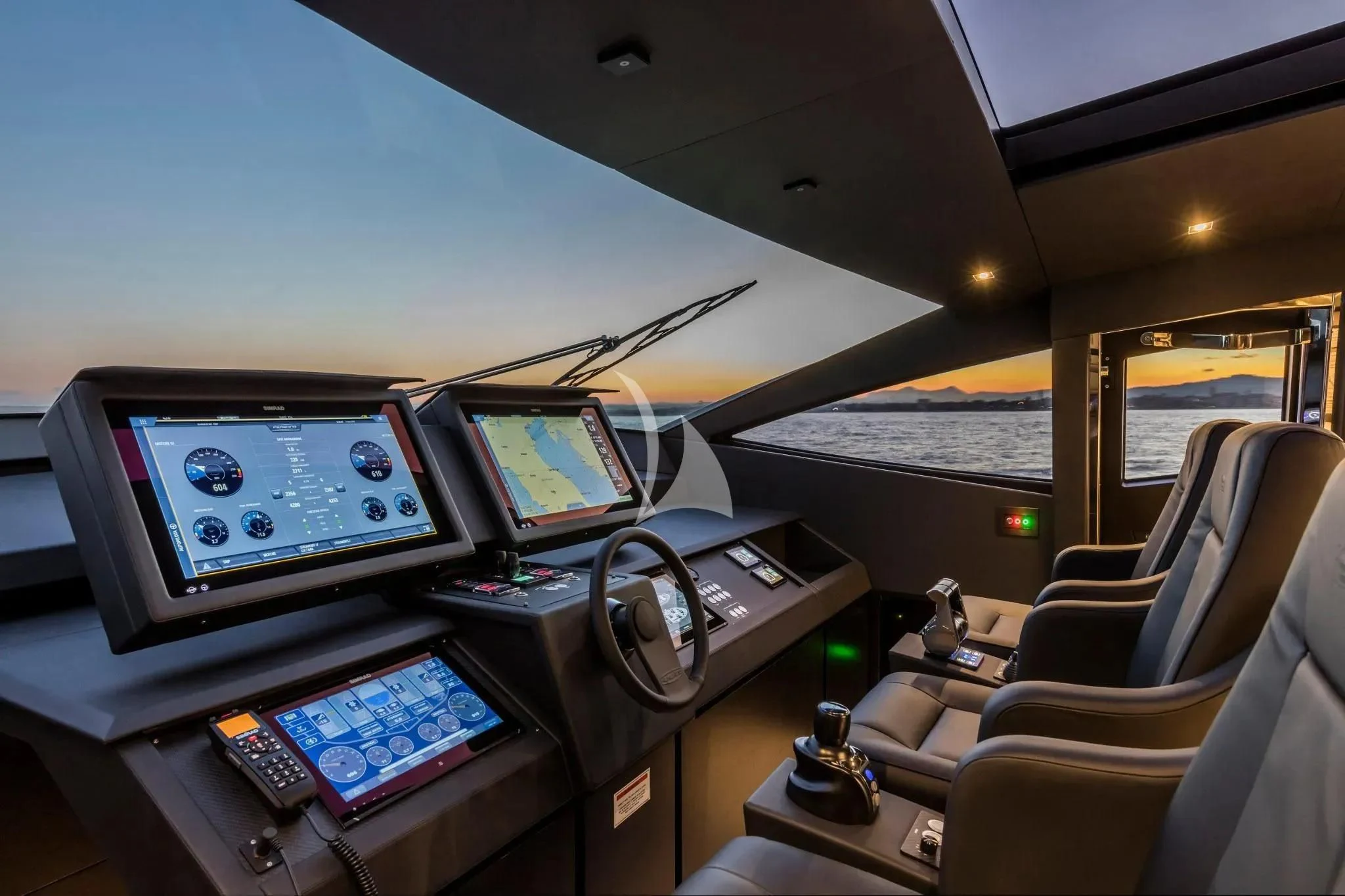 a plane with a desk and laptops aboard CHERRY Yacht for Charter