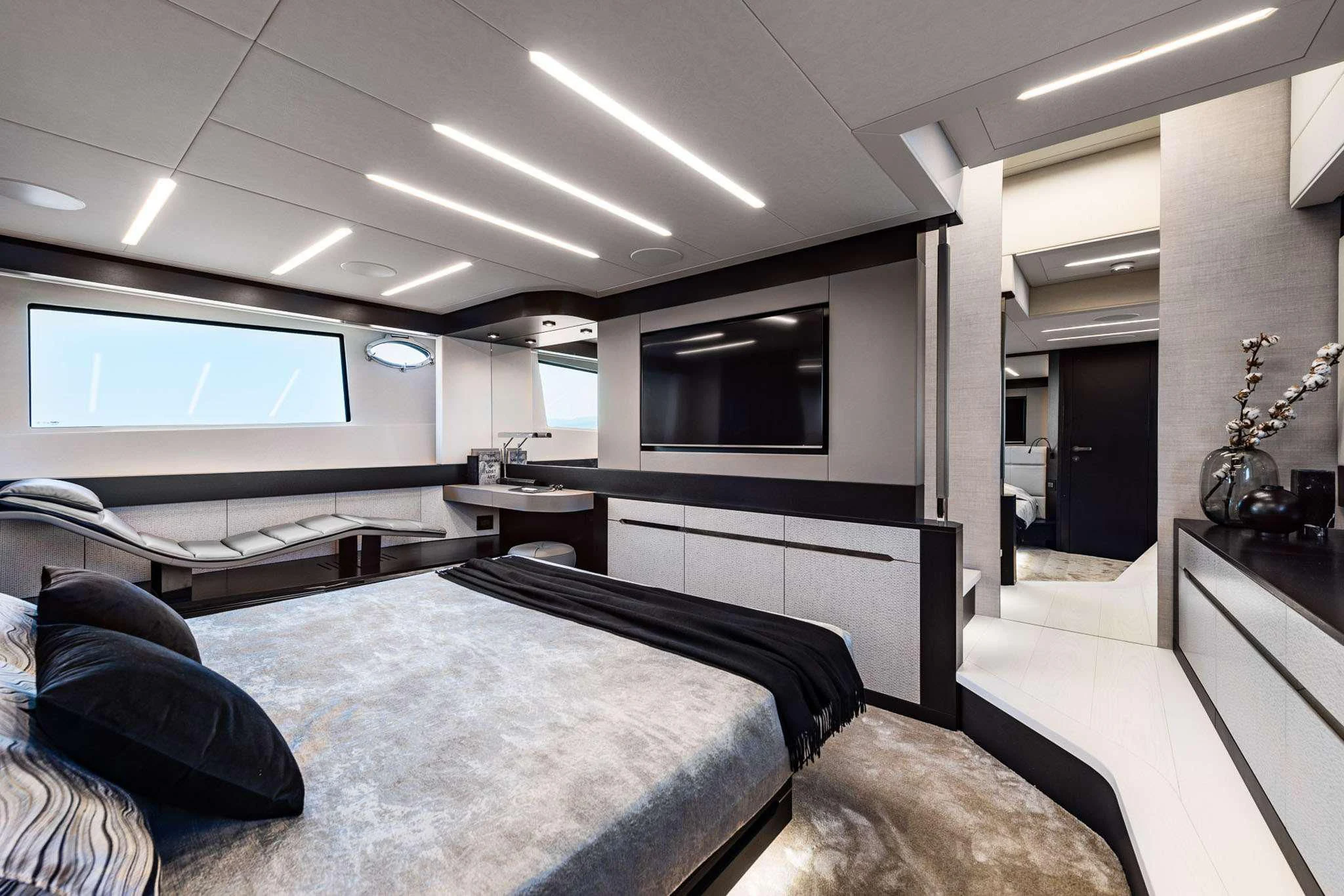a room with a bed and a tv aboard CHERRY Yacht for Charter