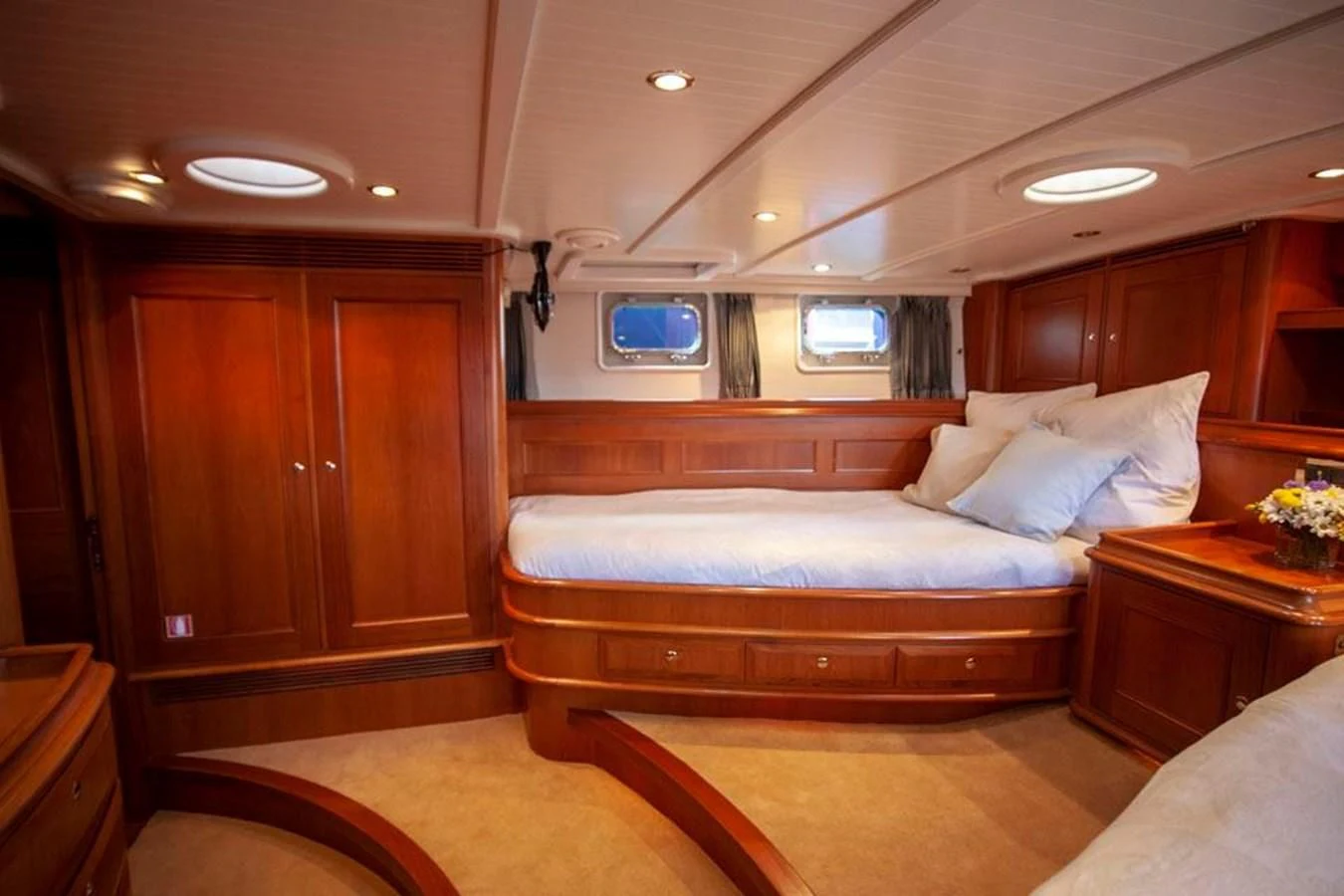 a bedroom with a bed and a television aboard SWEET EMOTION Yacht for Sale