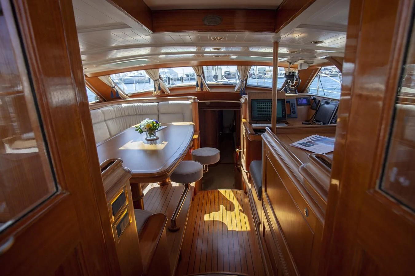 a room with a table and chairs aboard SWEET EMOTION Yacht for Sale
