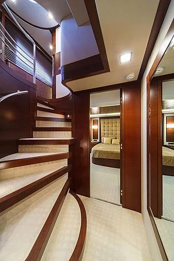 a room with a bed and a mirror aboard TARTARUGA ONE 4J'S Yacht for Sale