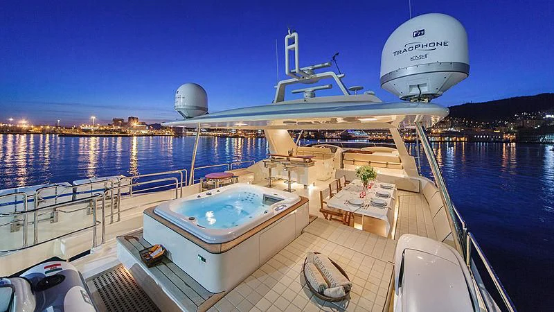 a large cruise ship docked aboard TARTARUGA ONE 4J'S Yacht for Sale