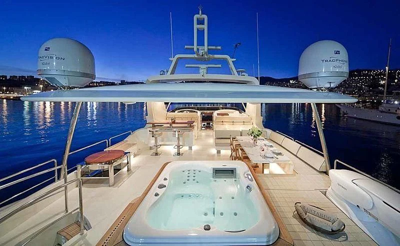 a large white ship docked aboard TARTARUGA ONE 4J'S Yacht for Sale