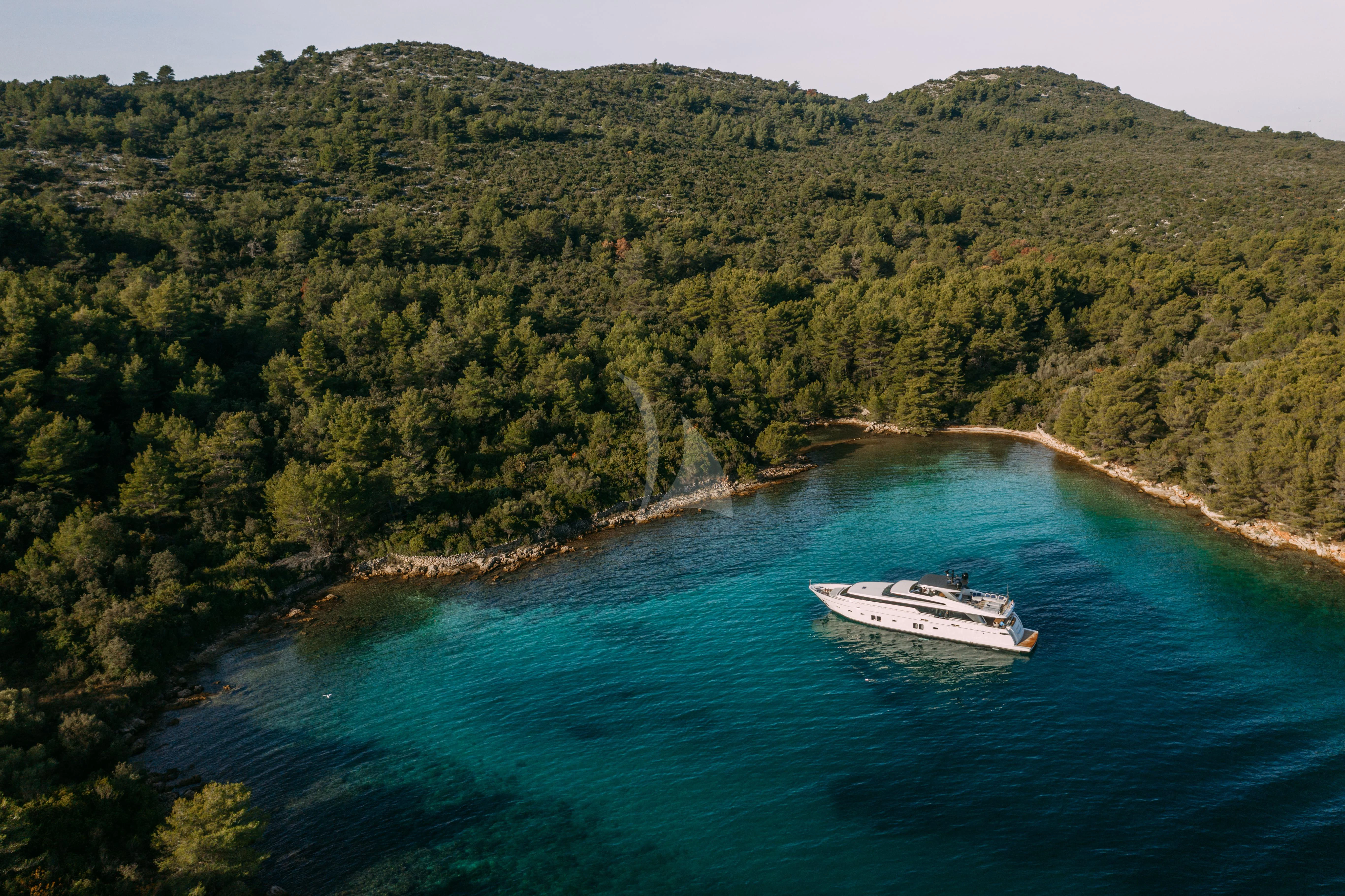 a boat sailing on a river aboard PARALOS Yacht for Charter