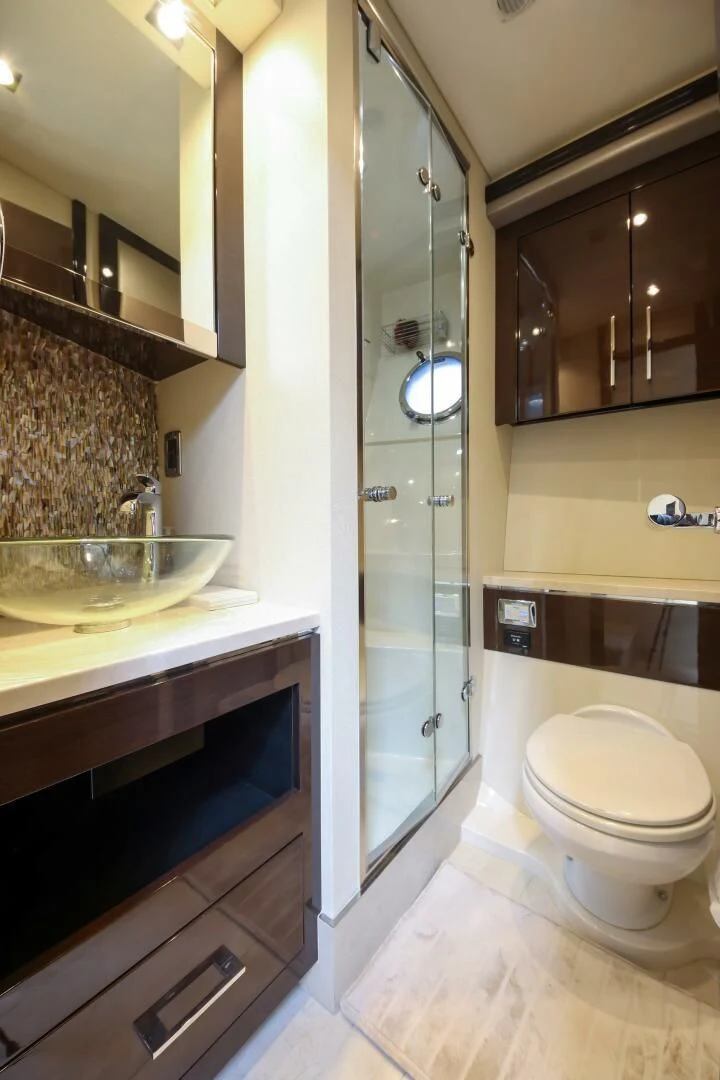 a bathroom with a glass shower aboard PARALOS Yacht for Charter