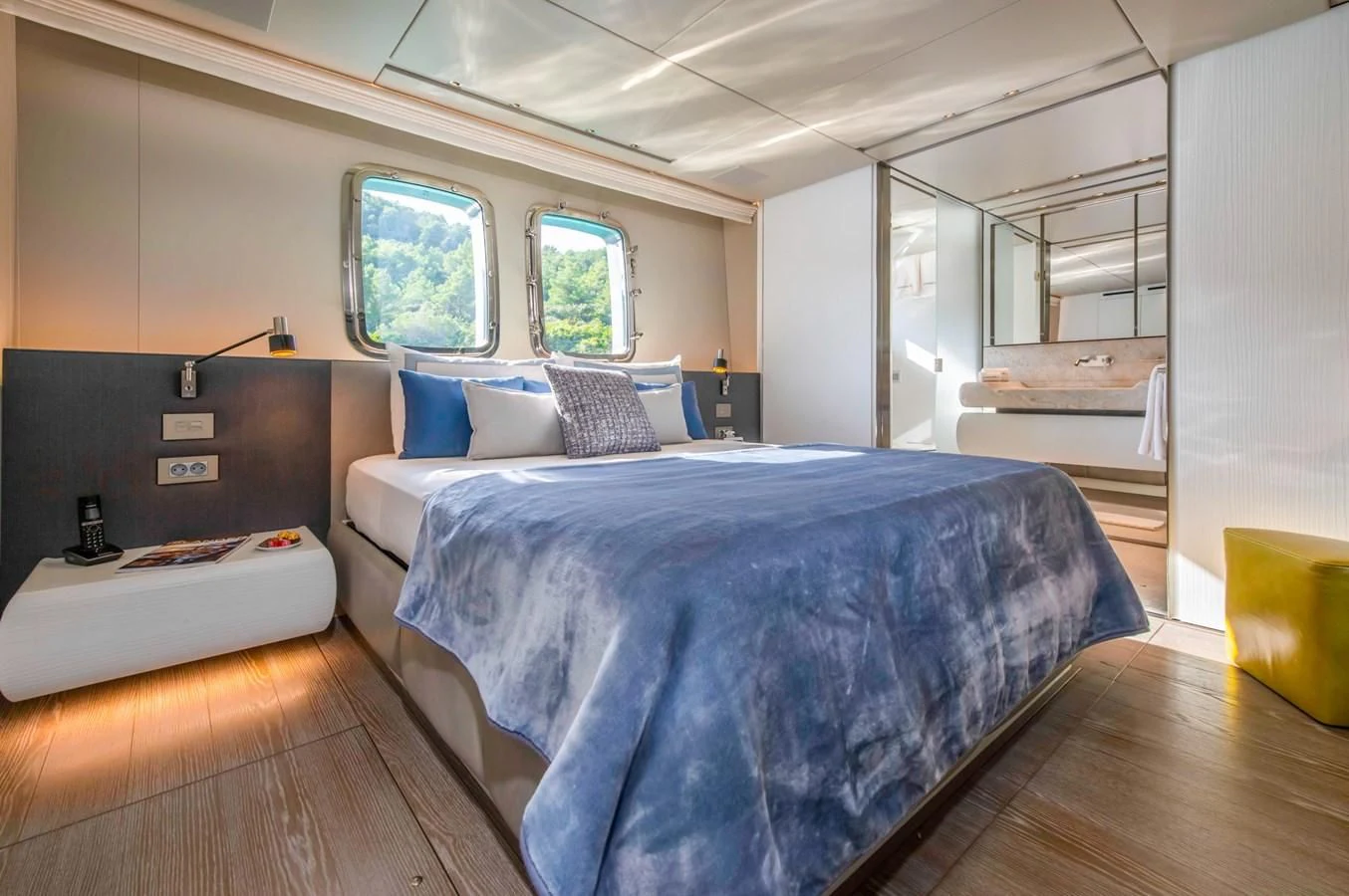 a bedroom with two beds aboard PARALOS Yacht for Charter