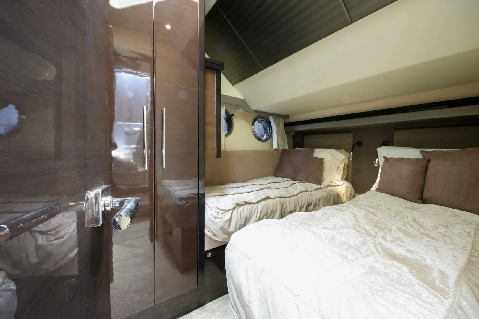 a bedroom with a bed and a closet aboard PARALOS Yacht for Charter