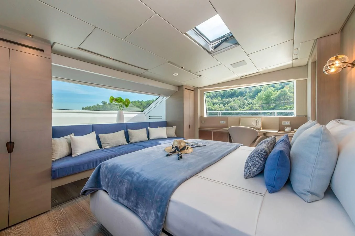 a room with a bed and a blue bed aboard PARALOS Yacht for Charter
