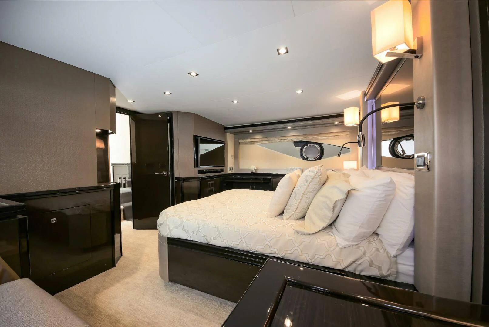 a bedroom with a bed and a desk aboard PARALOS Yacht for Charter