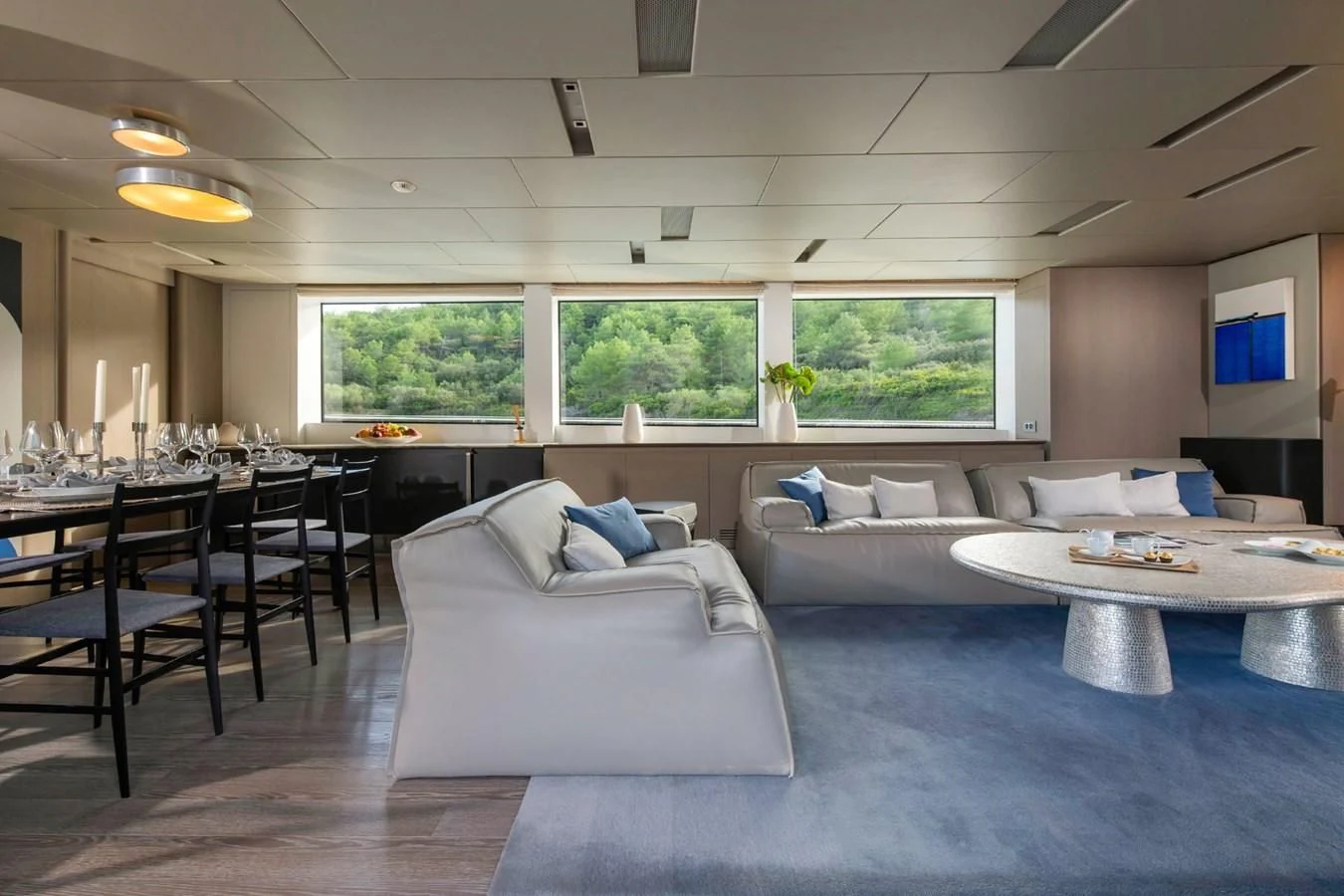 a living room with a couch and a table aboard PARALOS Yacht for Charter