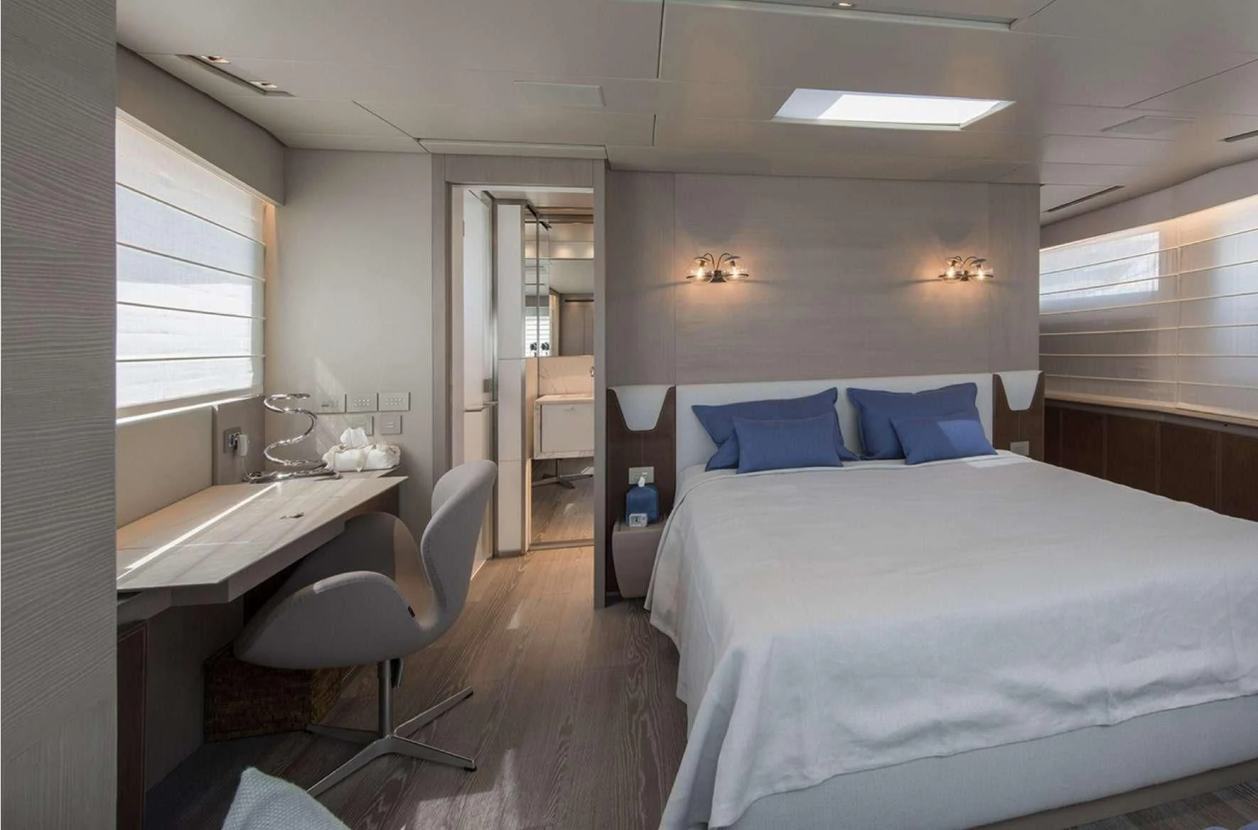 a room with a bed and a sink aboard PARALOS Yacht for Charter