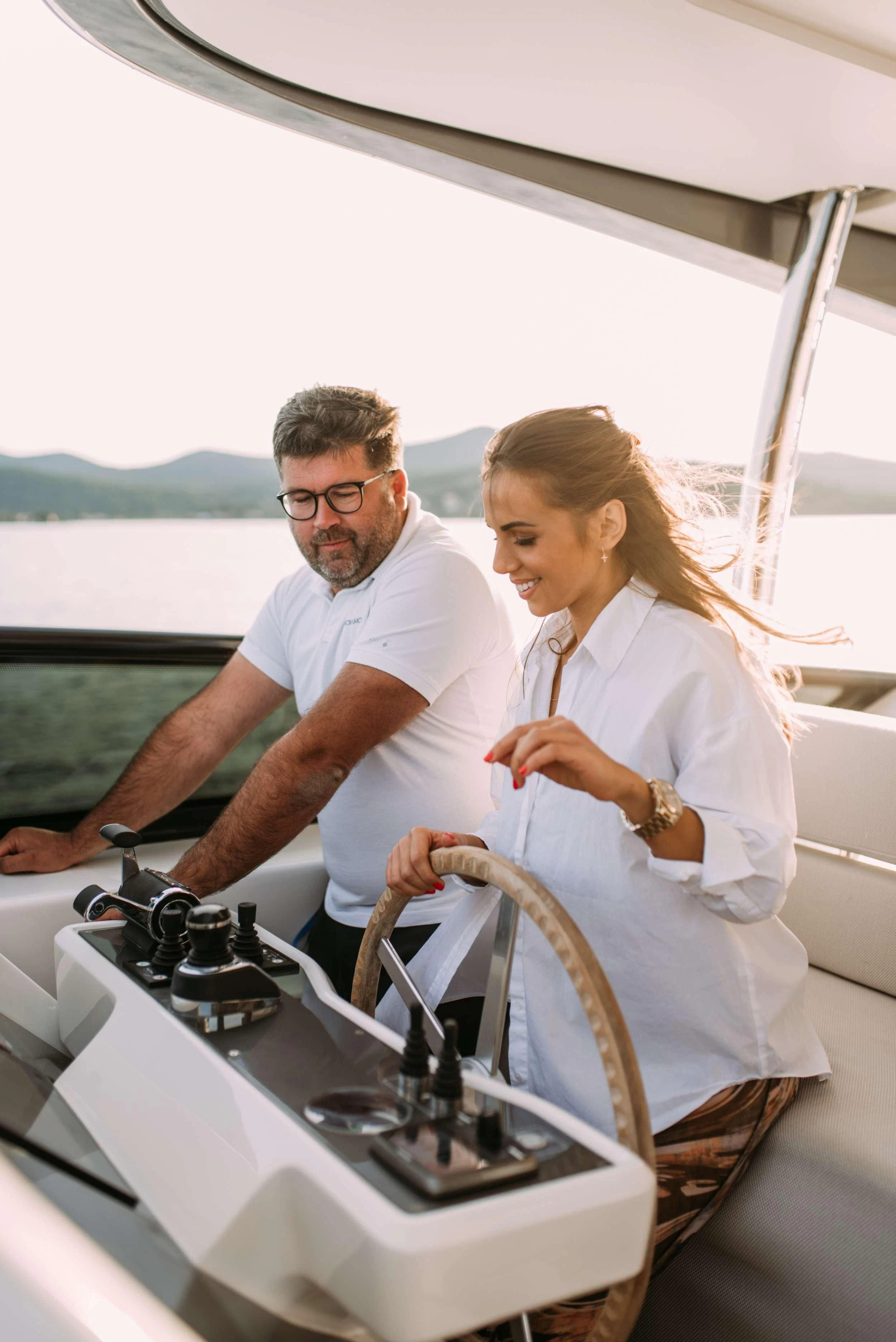 a man and woman in a boat aboard PARALOS Yacht for Charter