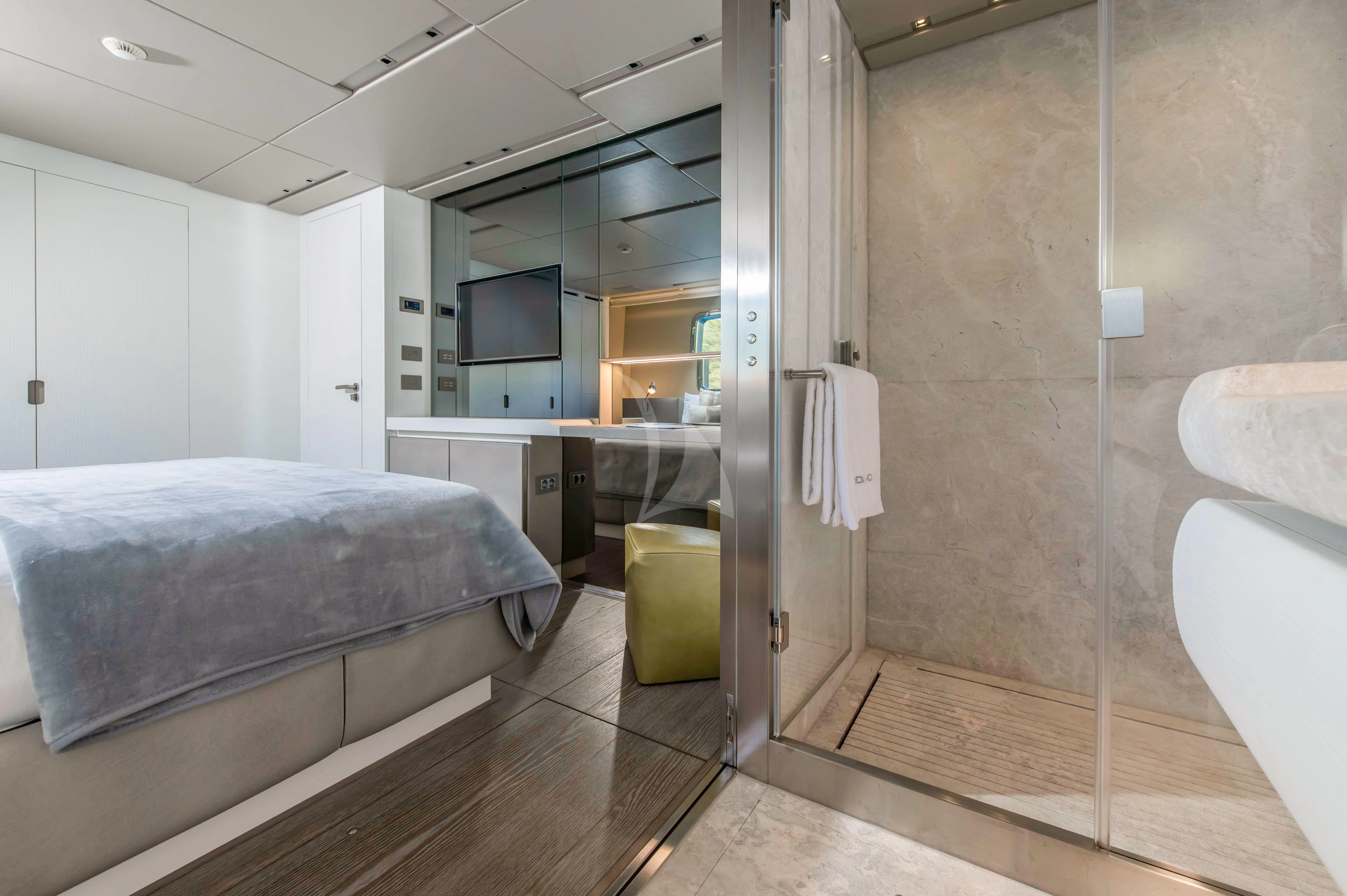a room with a bed and a sink aboard PARALOS Yacht for Charter