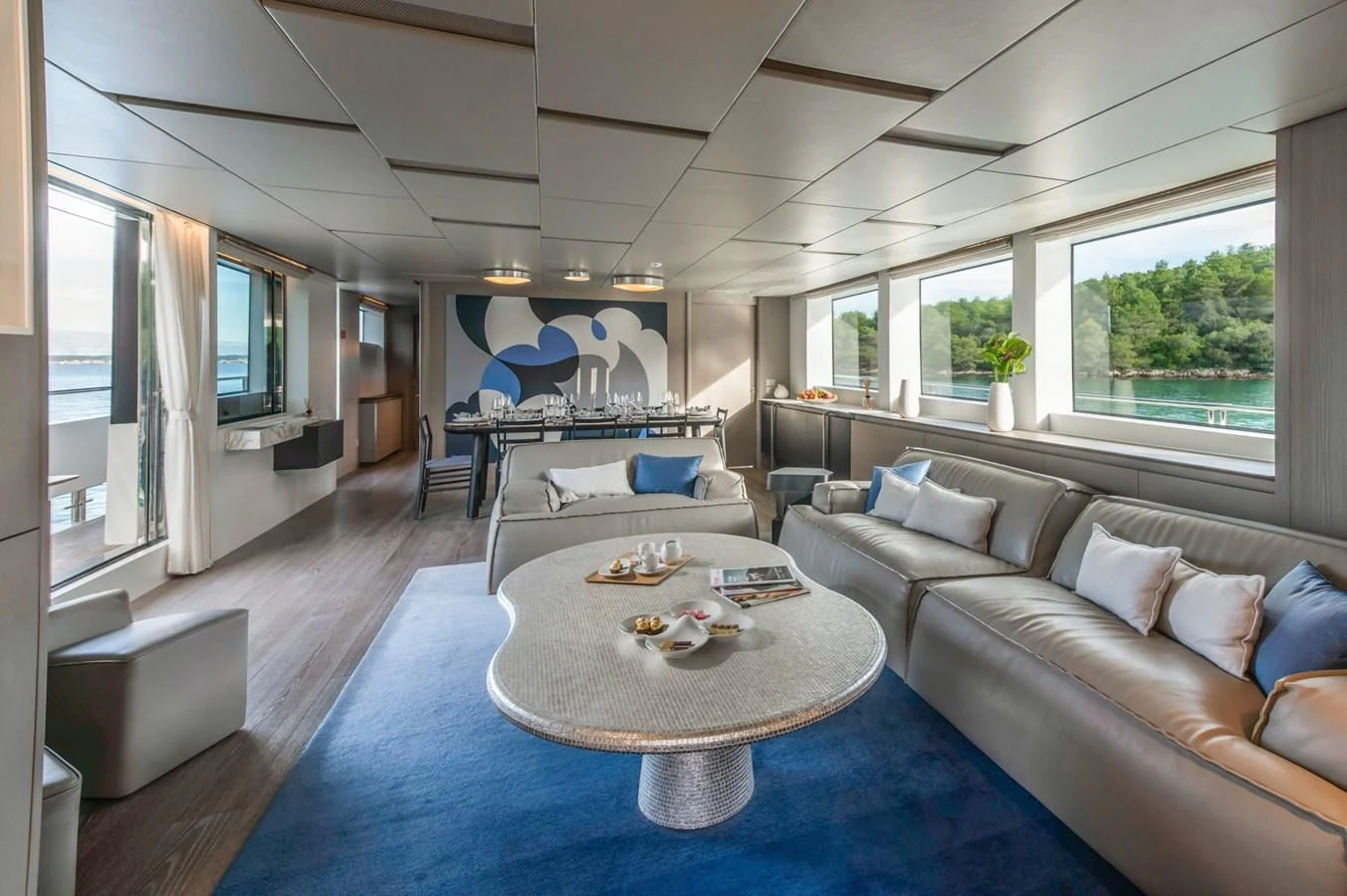 a living room with a couch and a table aboard PARALOS Yacht for Charter