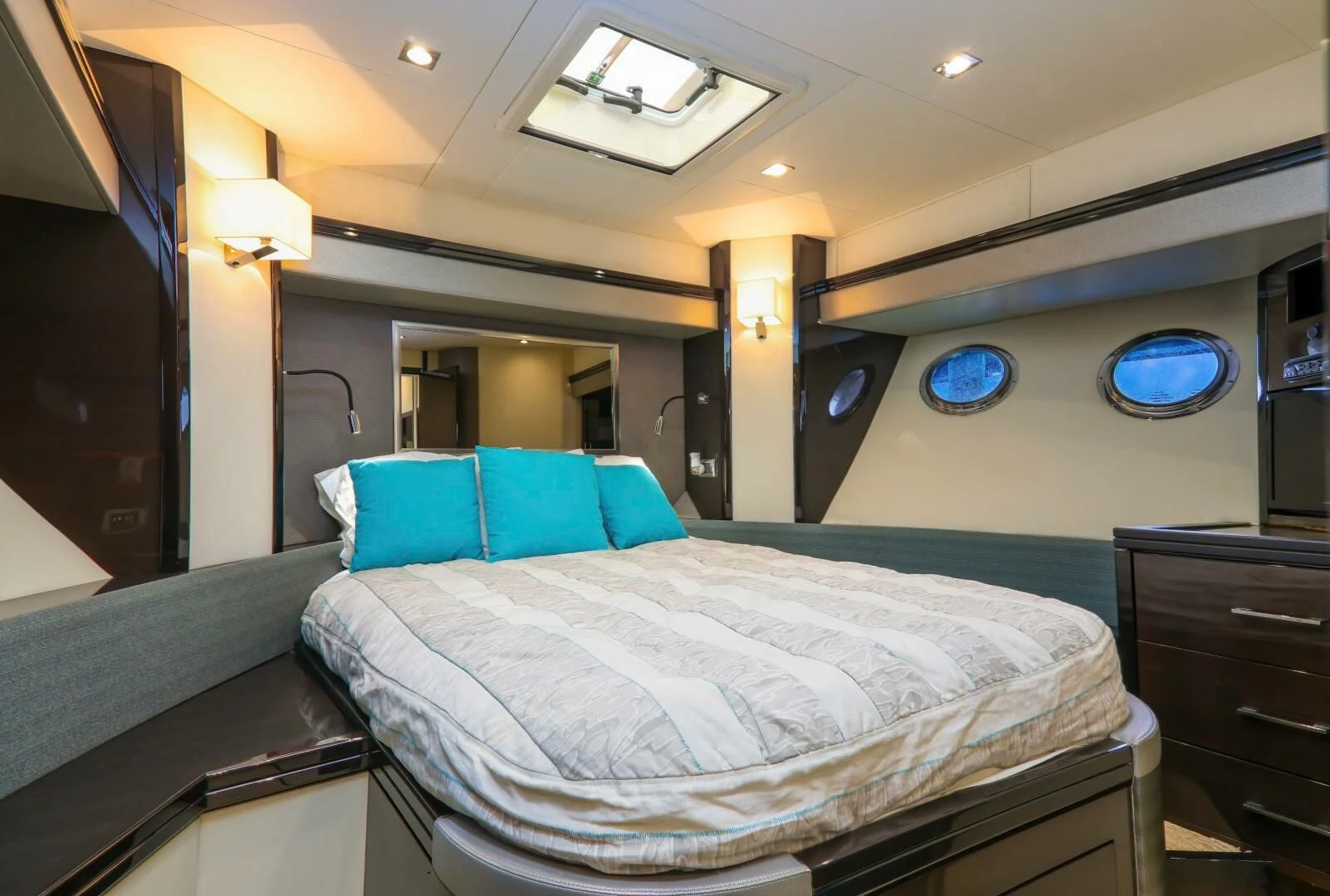 a room with a bed and a desk aboard PARALOS Yacht for Charter