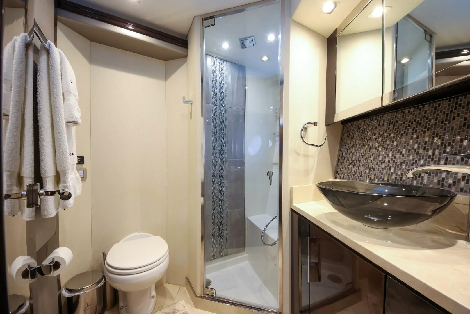 a bathroom with a glass shower aboard PARALOS Yacht for Charter