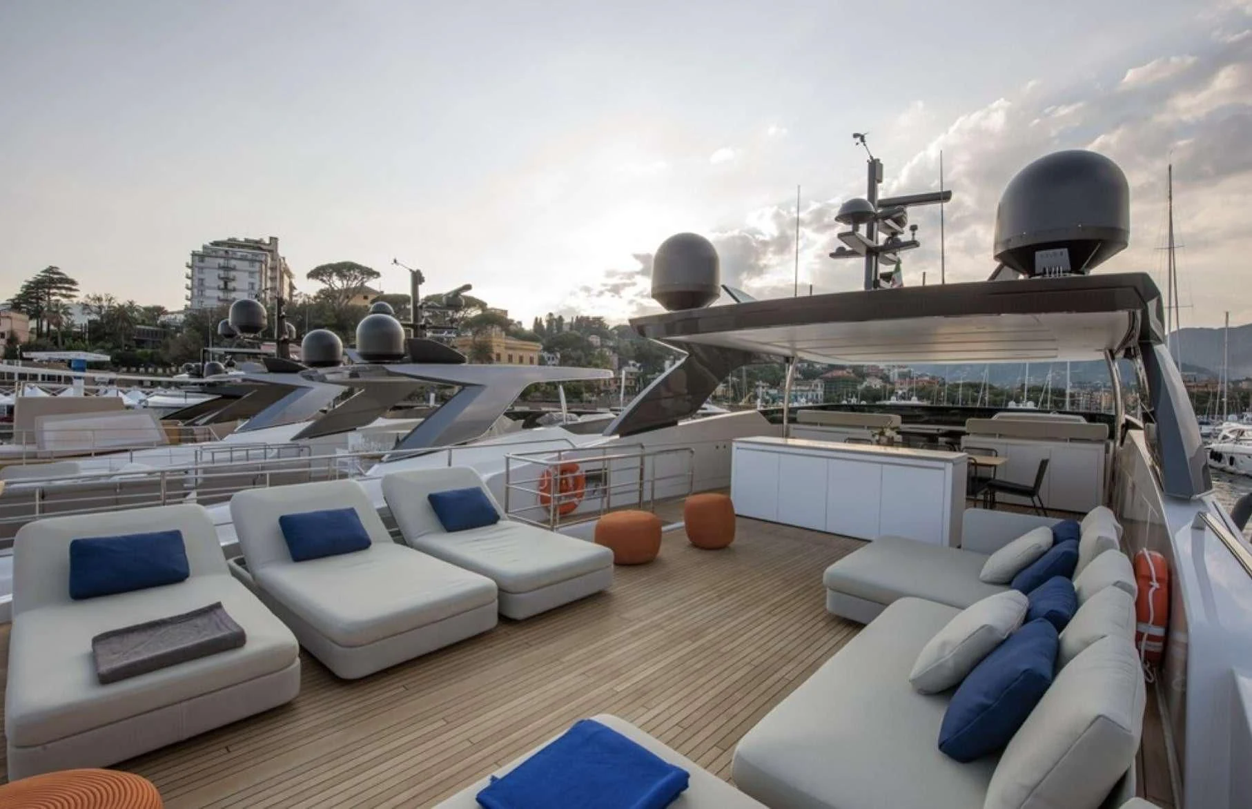 a deck with a pool and a large building with a water slide aboard PARALOS Yacht for Charter