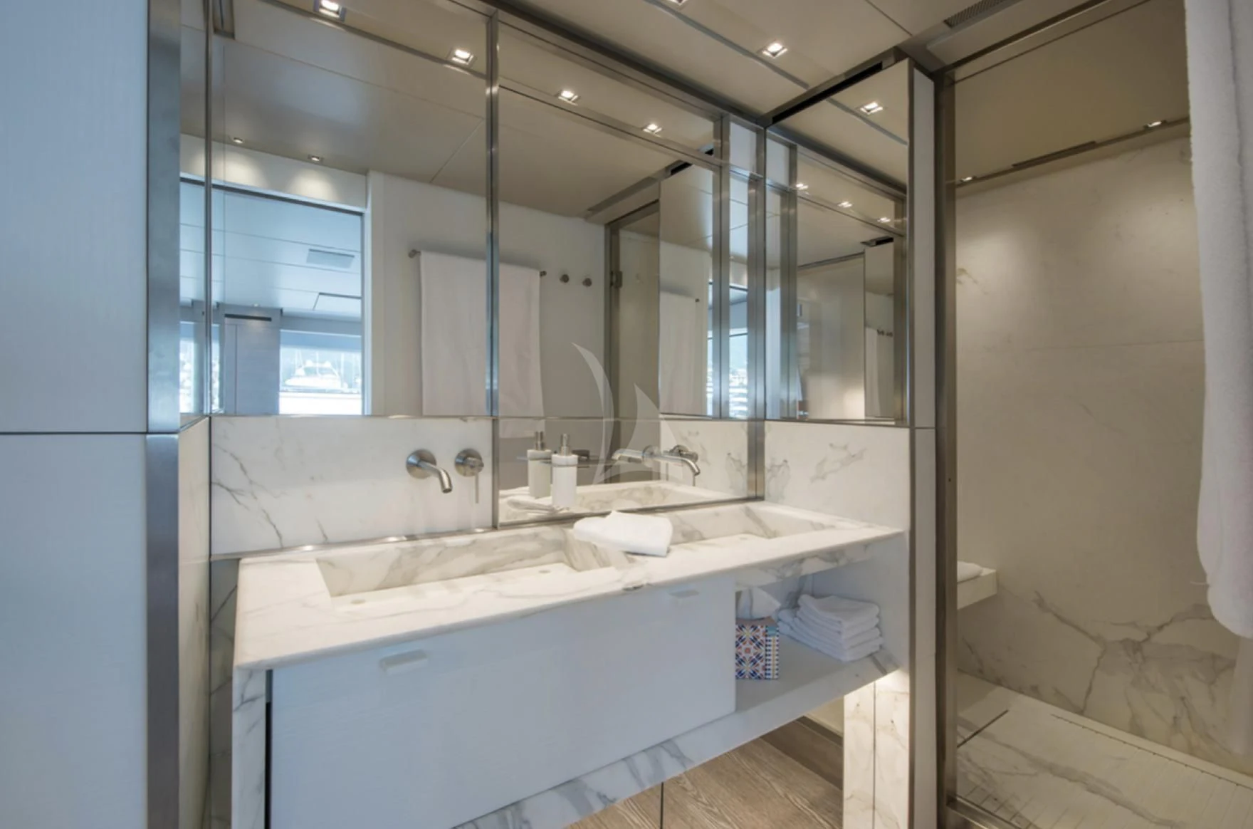 a bathroom with a large mirror aboard PARALOS Yacht for Charter