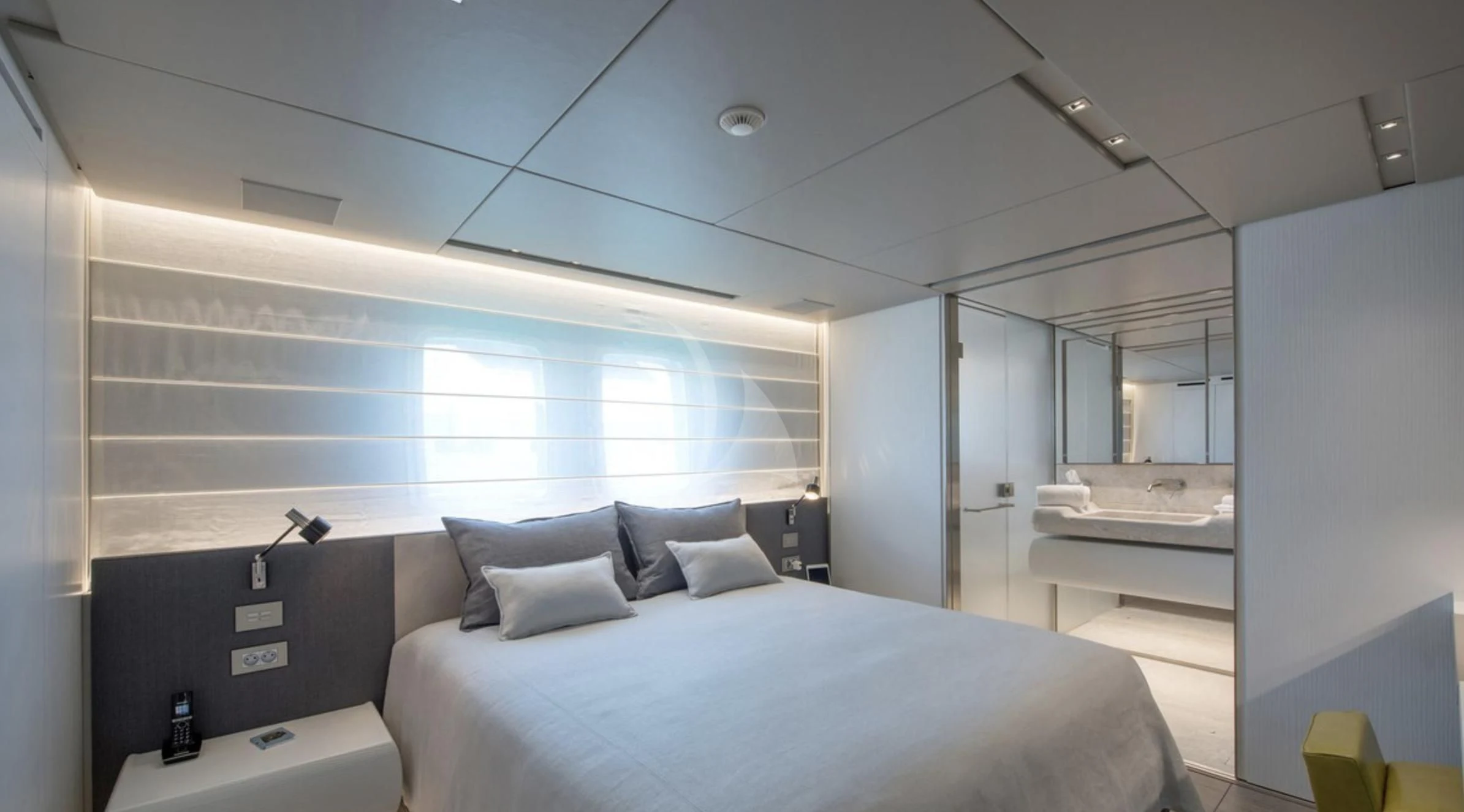 a room with a bed and a window aboard PARALOS Yacht for Charter