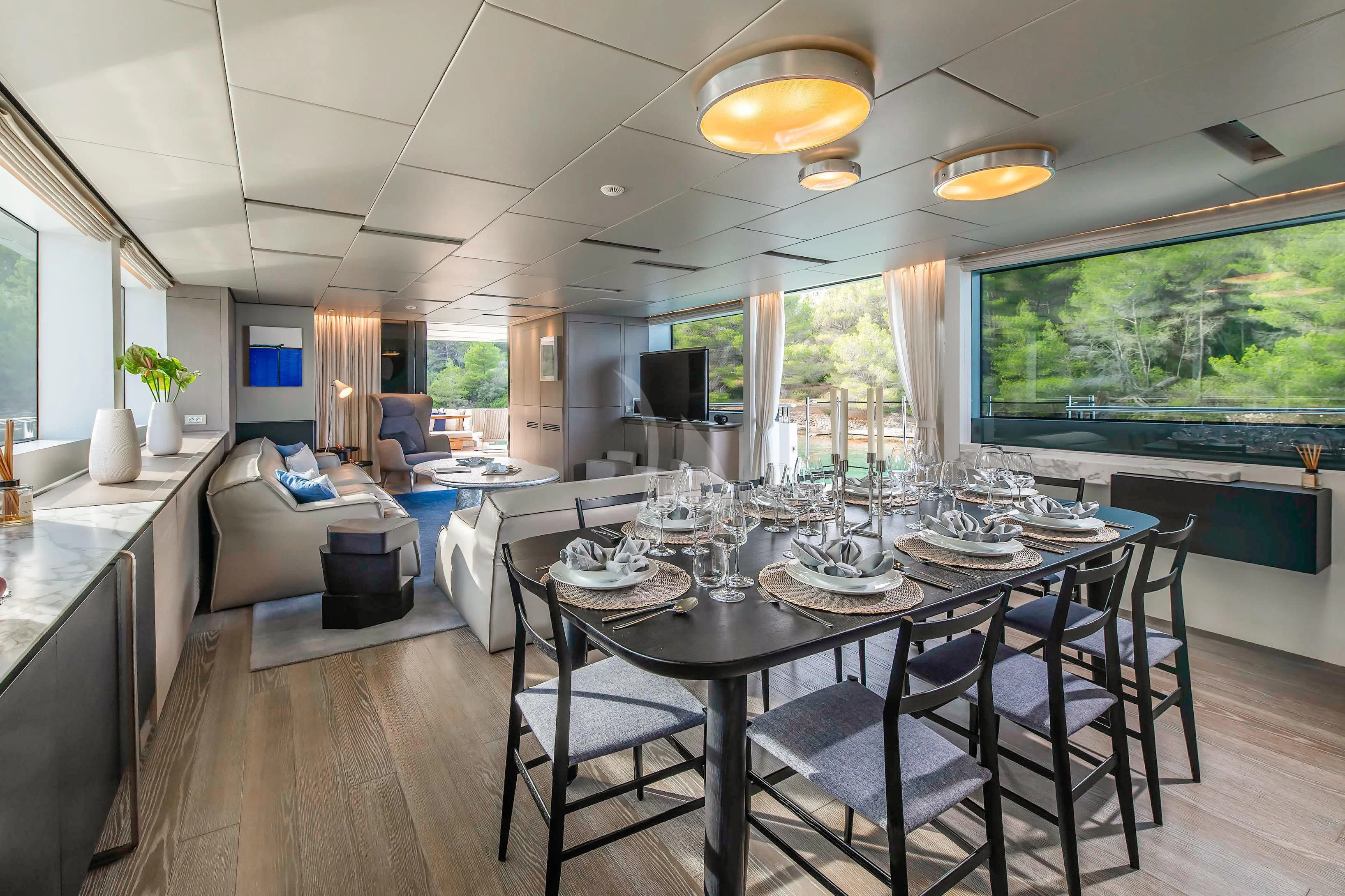 a large dining room with a large table and chairs aboard PARALOS Yacht for Charter