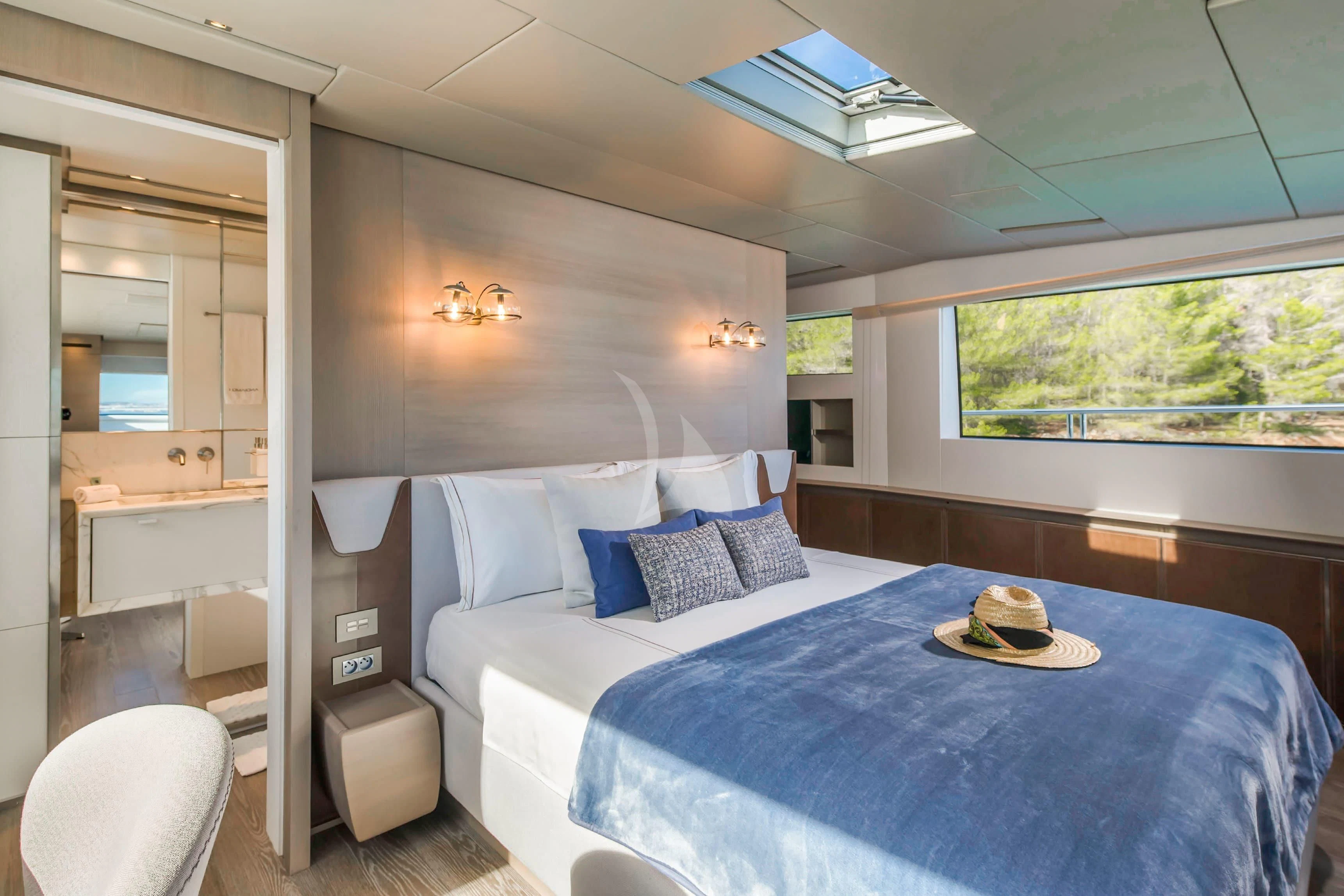 a large bedroom with a large bed aboard PARALOS Yacht for Charter