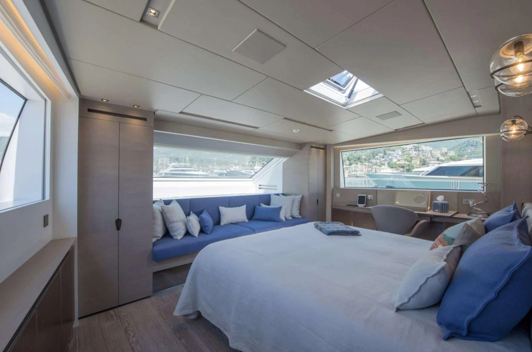 a room with a bed and a window aboard PARALOS Yacht for Charter
