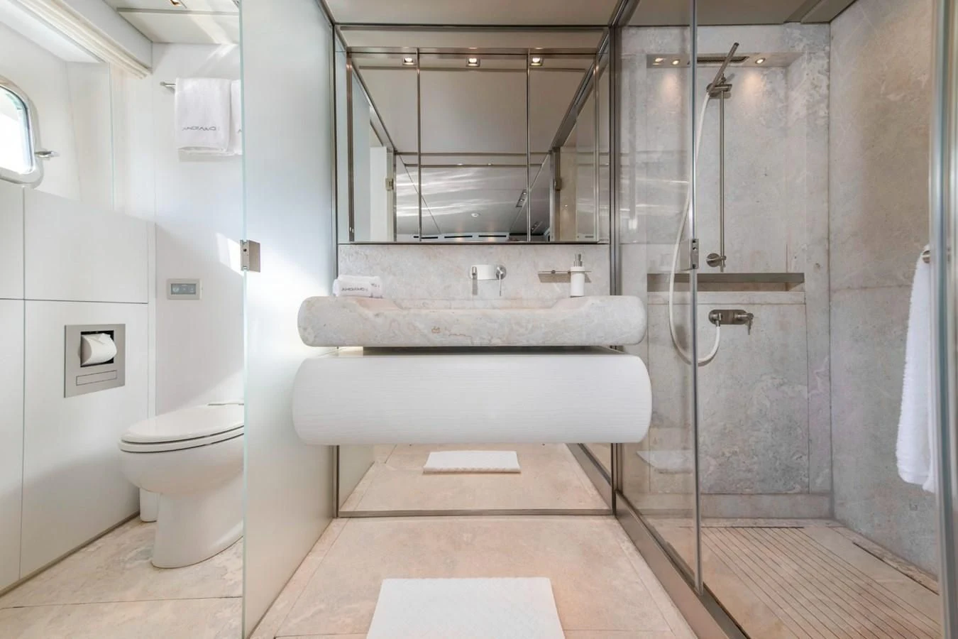 a bathroom with a sink toilet and bathtub aboard PARALOS Yacht for Charter