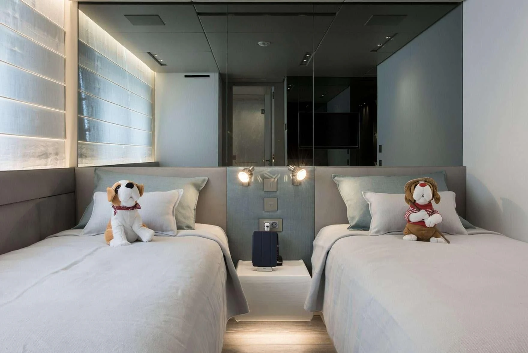 a couple of stuffed animals on a bed aboard PARALOS Yacht for Charter