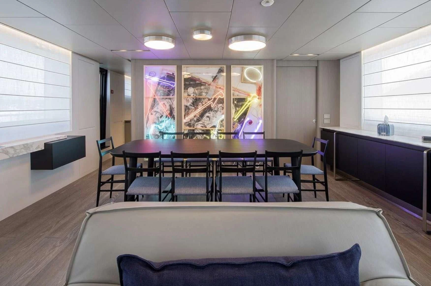 a room with a couch and a table and chairs aboard PARALOS Yacht for Charter