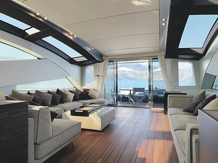 a living room with a large window aboard HOOLIGAN Yacht for Sale
