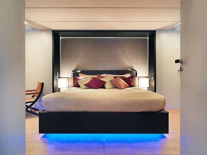 a bed with a blue cover aboard HOOLIGAN Yacht for Sale