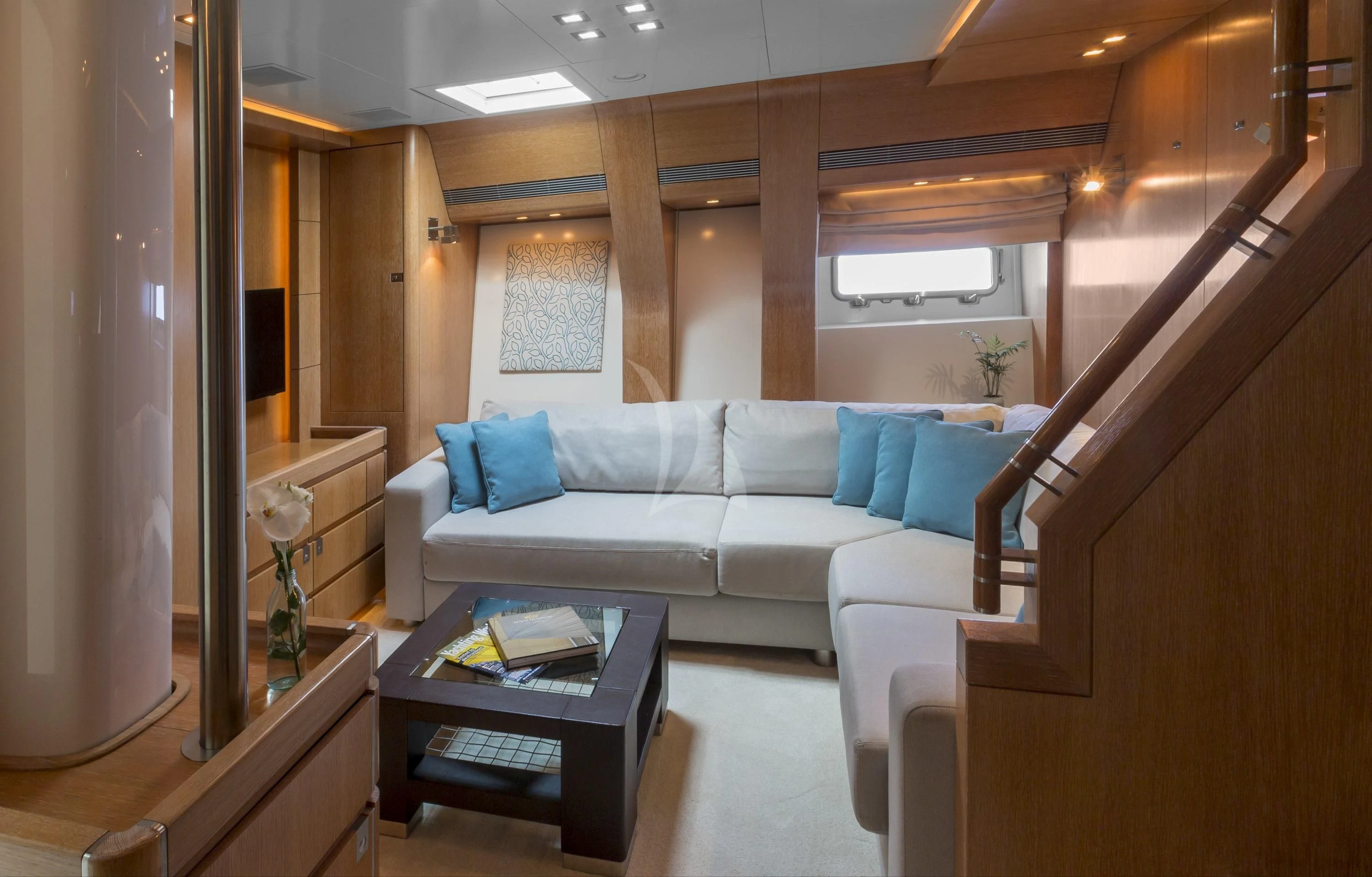 a living room with a couch and a coffee table aboard GLISS Yacht for Sale