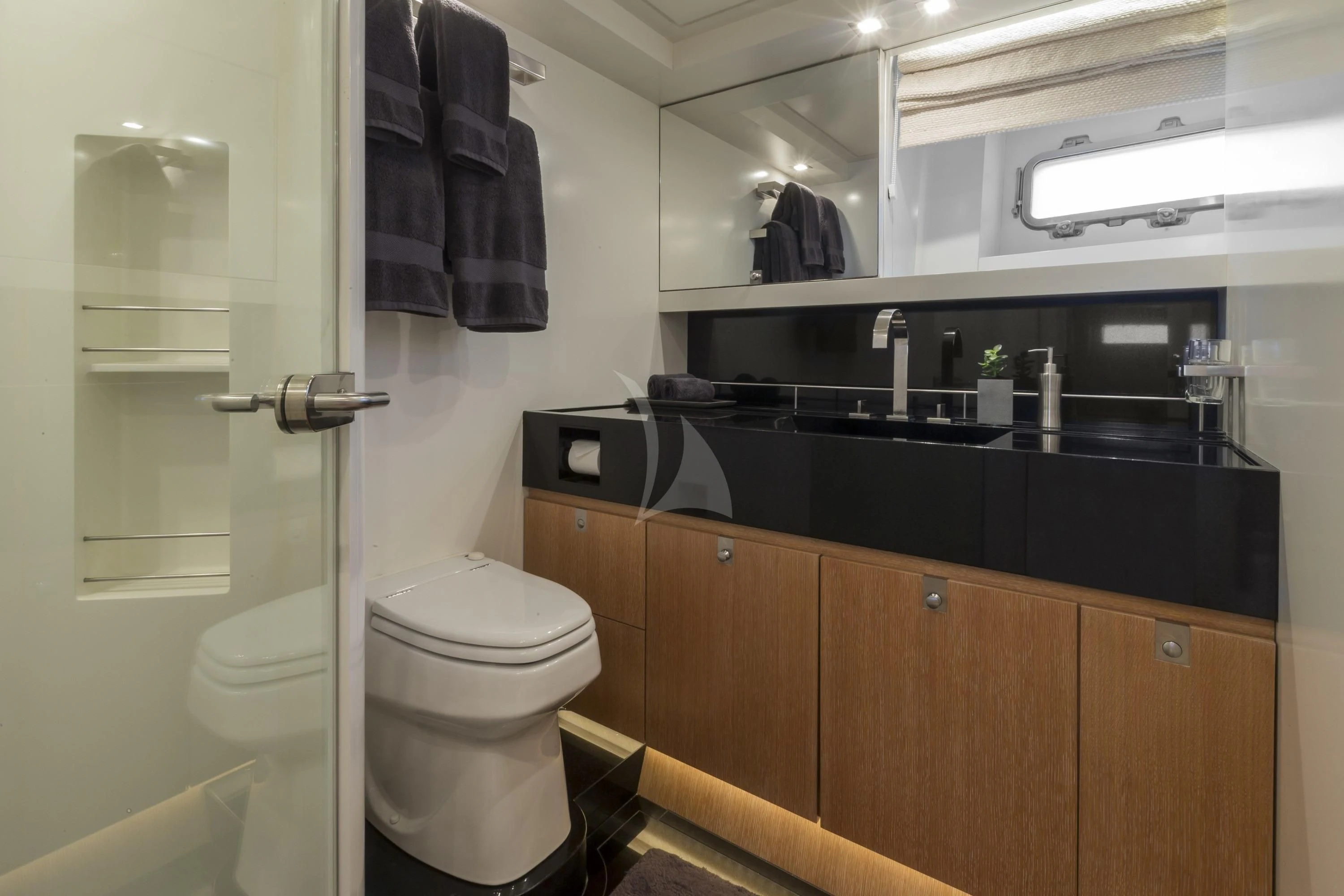 a bathroom with a toilet and a sink aboard GLISS Yacht for Sale