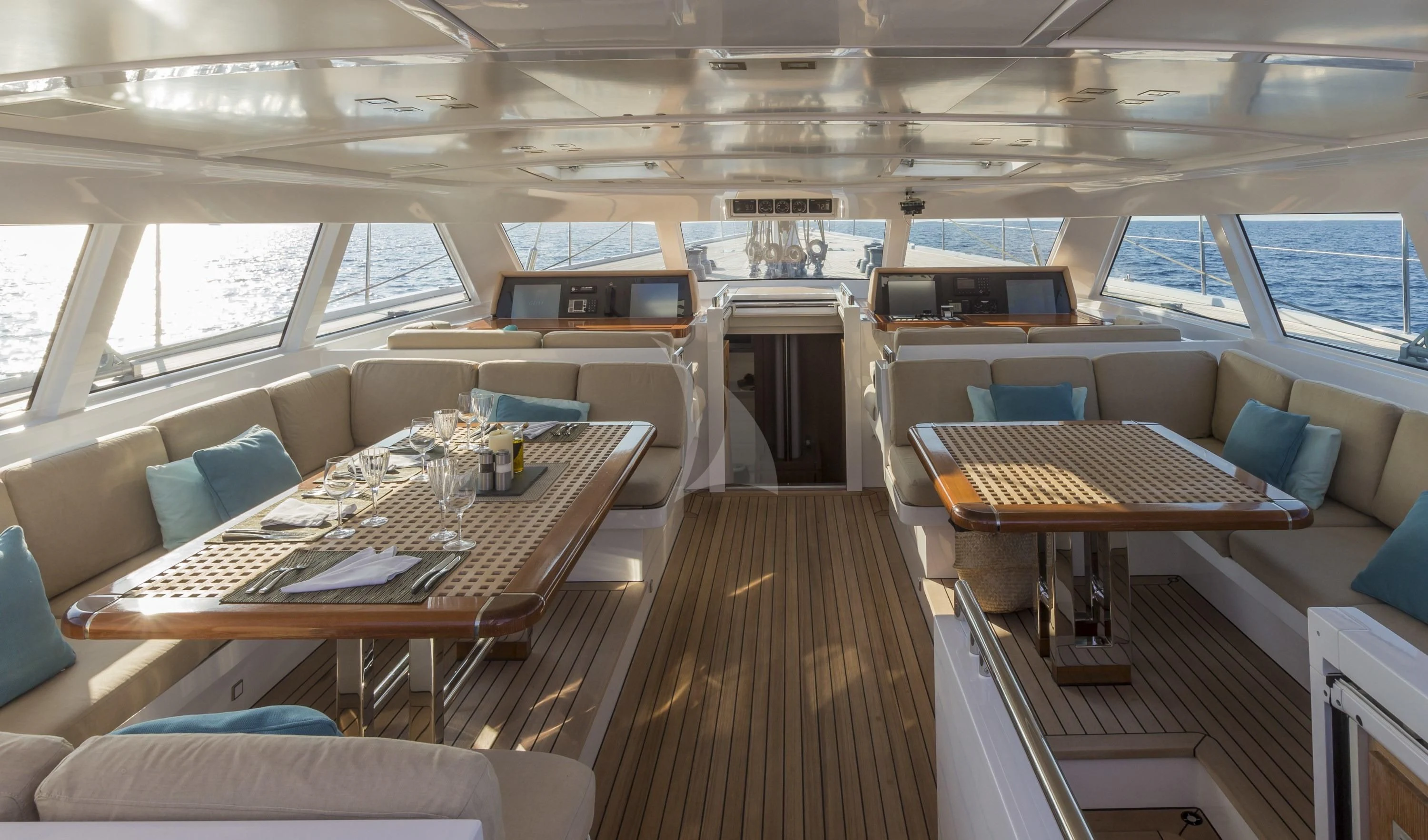 a room with a table and chairs aboard GLISS Yacht for Sale