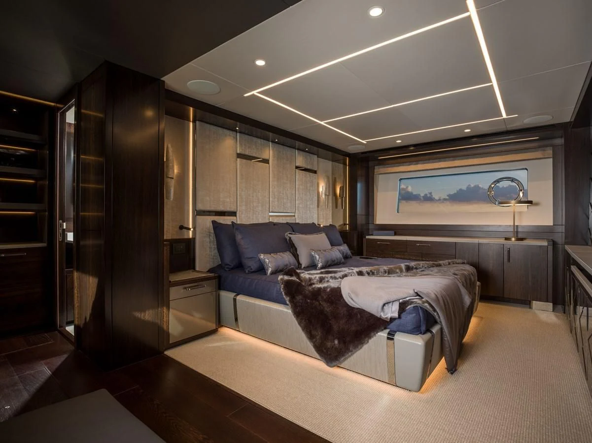 a large bedroom with a bed aboard MOWANA Yacht for Sale