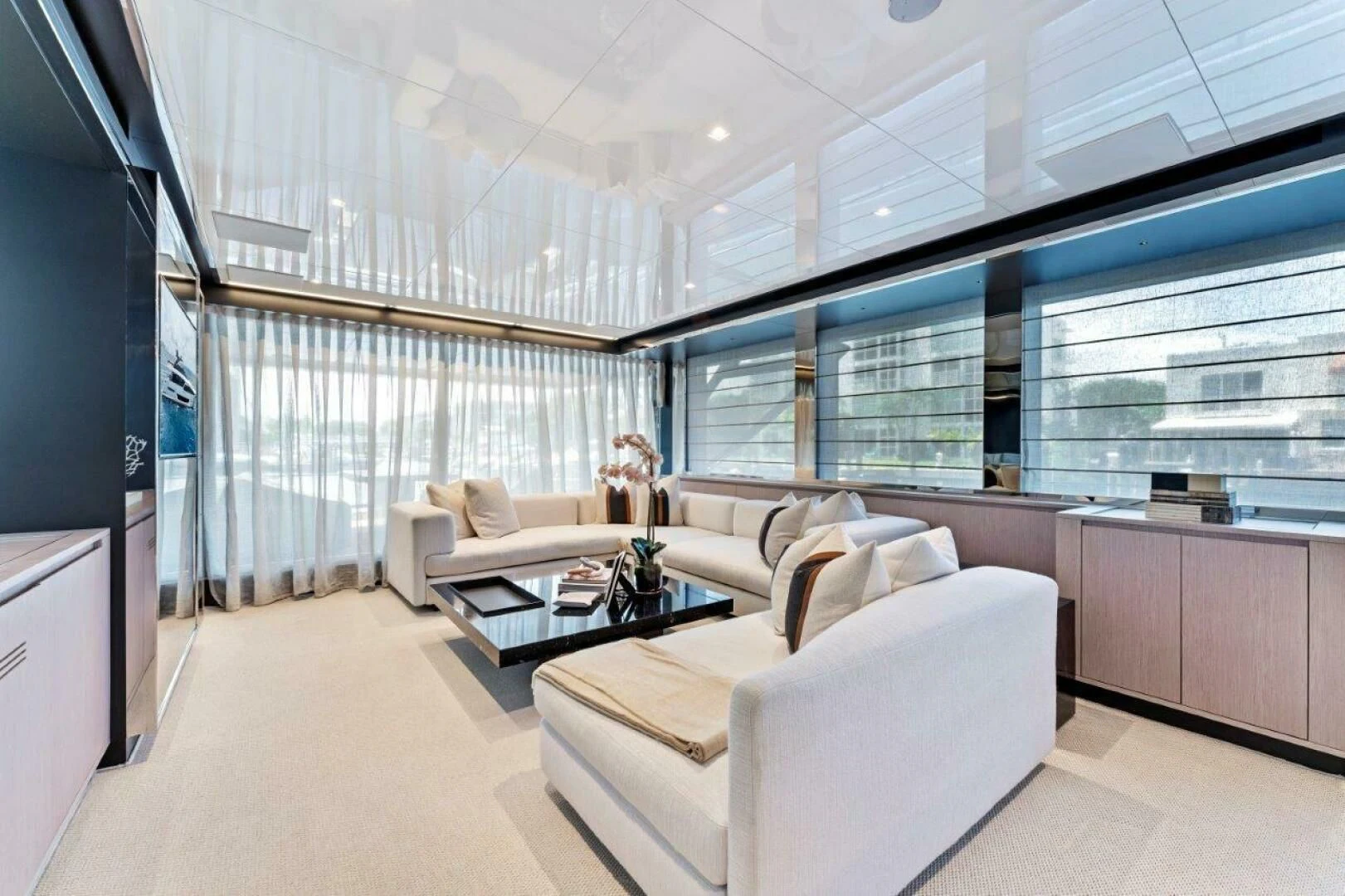 a room with a couch and a coffee table aboard OUR TRADE Yacht for Sale