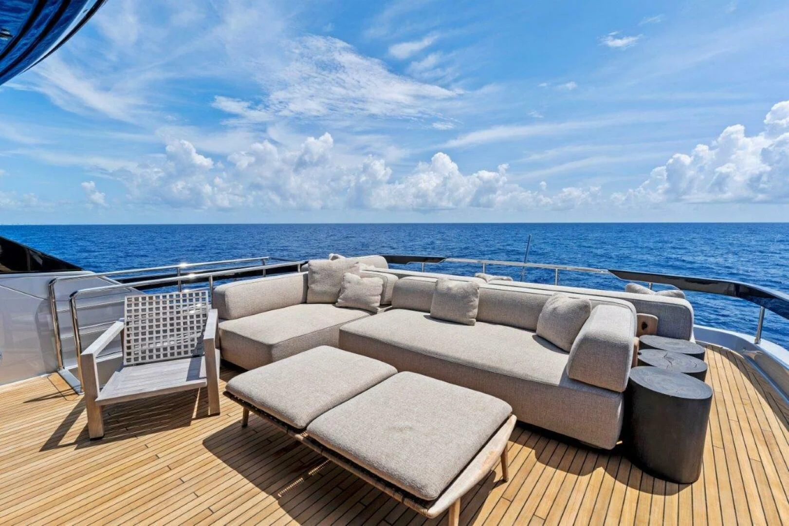 a deck with chairs on it by the ocean aboard OUR TRADE Yacht for Sale