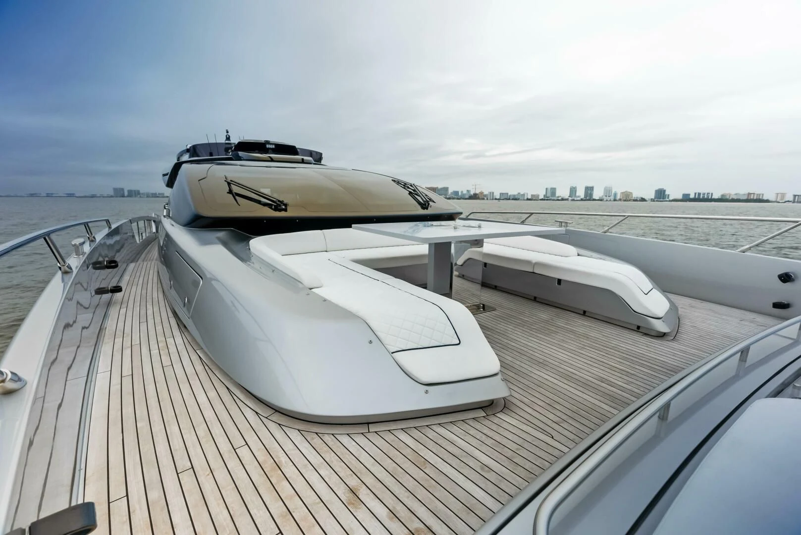 a white boat on a deck aboard OUR TRADE Yacht for Sale