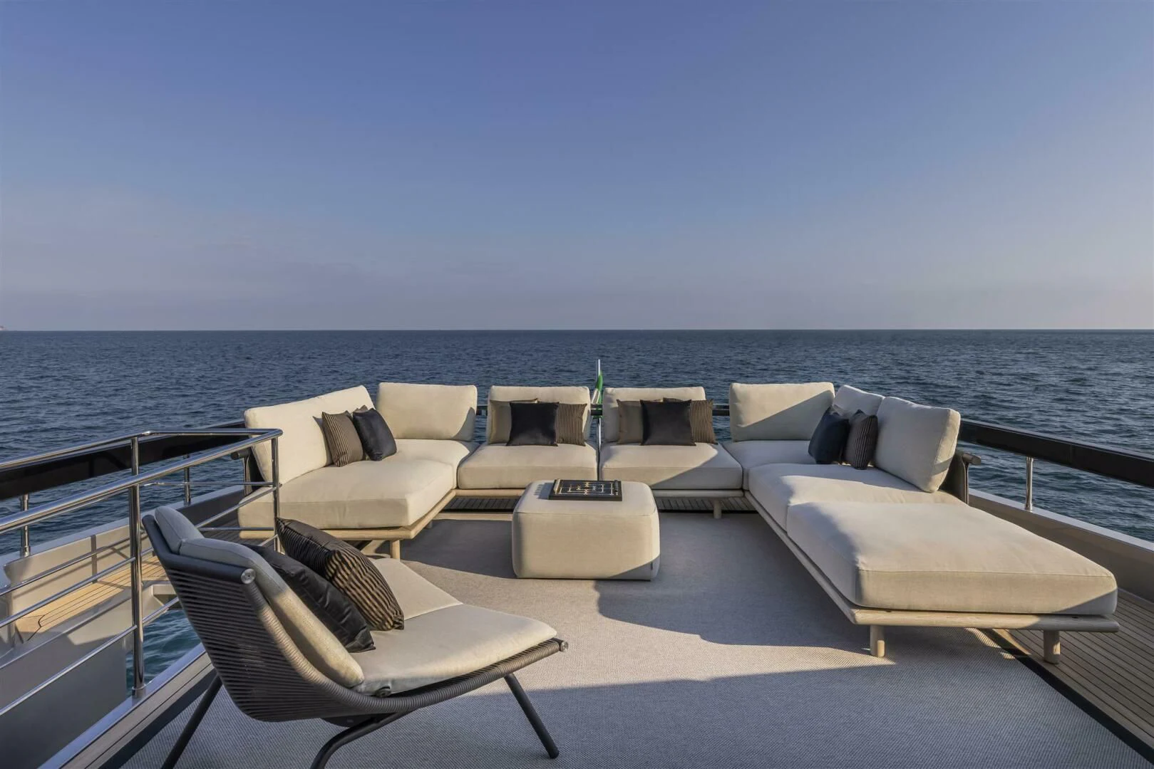 a deck with chairs and a table on it aboard OUR TRADE Yacht for Sale