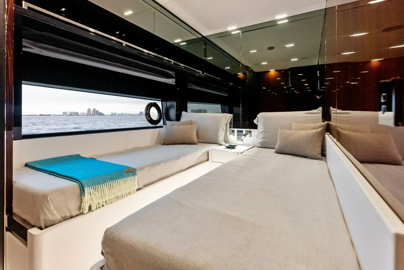 a room with a bed and a large window aboard OUR TRADE Yacht for Sale