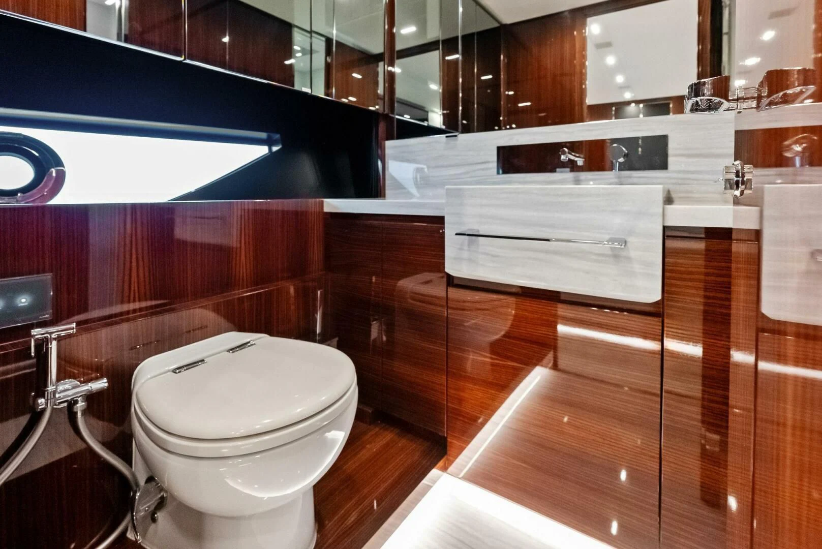 a bathroom with a toilet and a sink aboard OUR TRADE Yacht for Sale